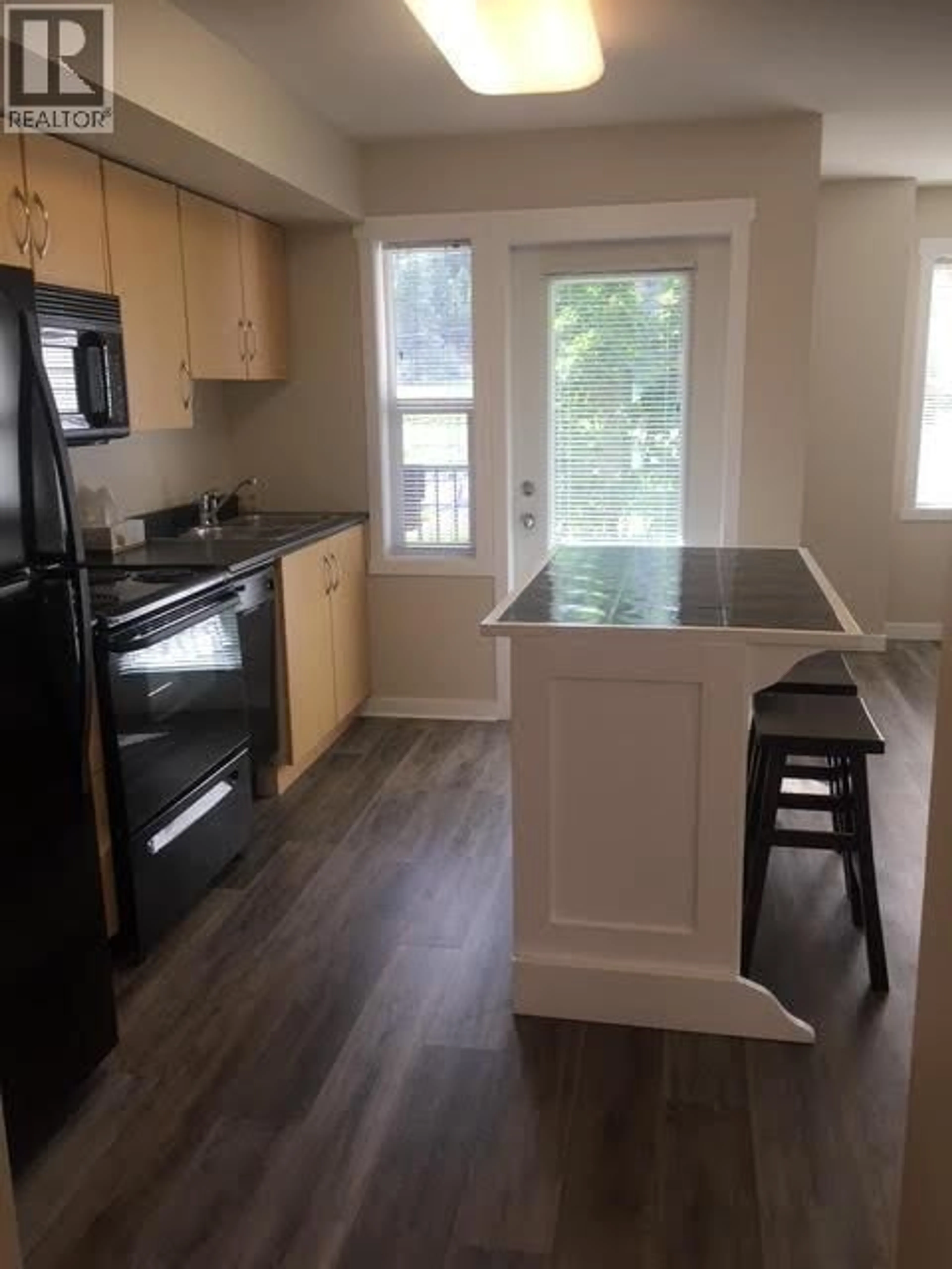 Standard kitchen, wood/laminate floor for 105A - 1475 GLENMORE ROAD NORTH, Kelowna British Columbia V1V2C5