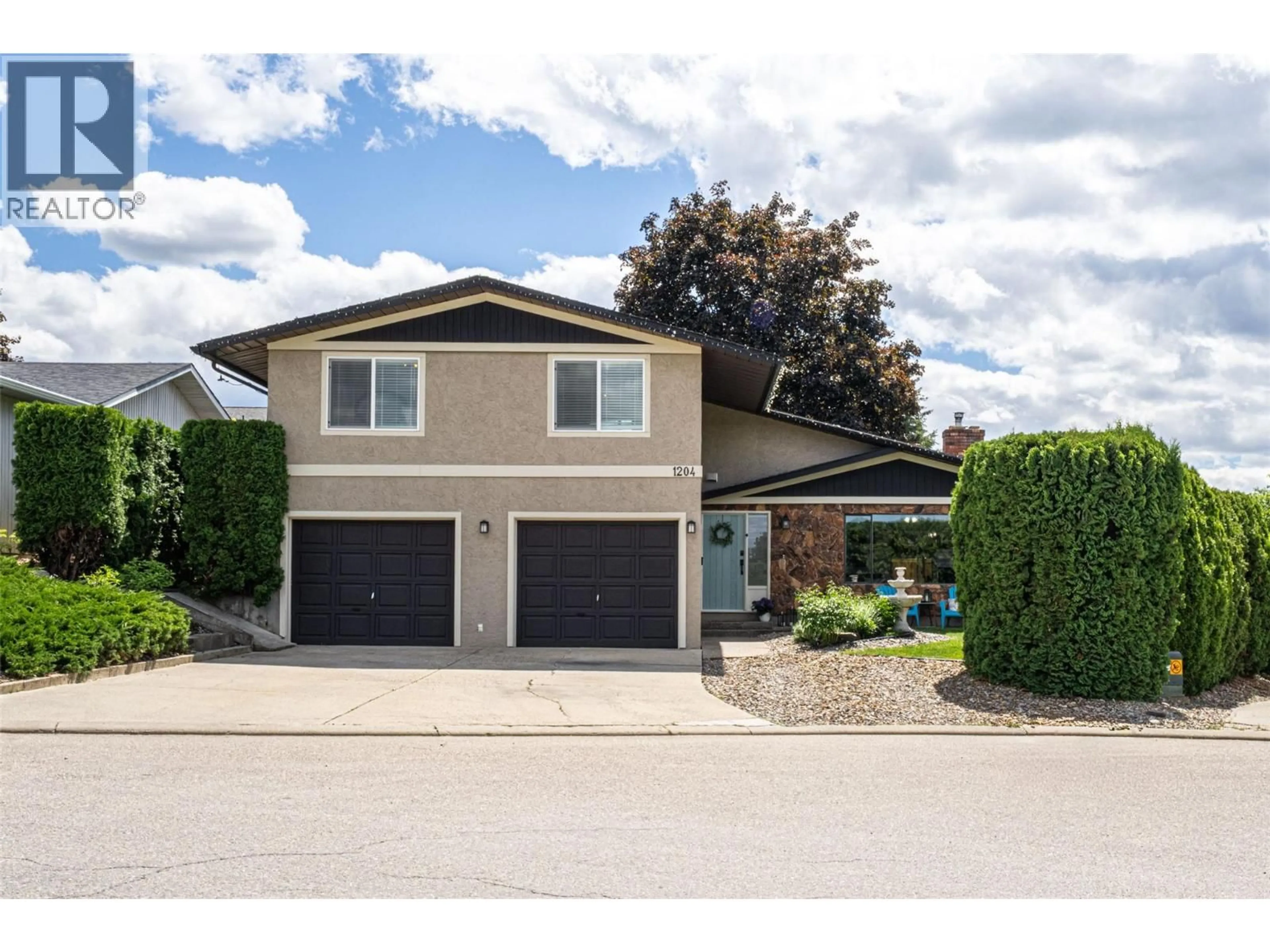 Home with vinyl exterior material, street for 1204 42 AVENUE, Vernon British Columbia V1B4A2