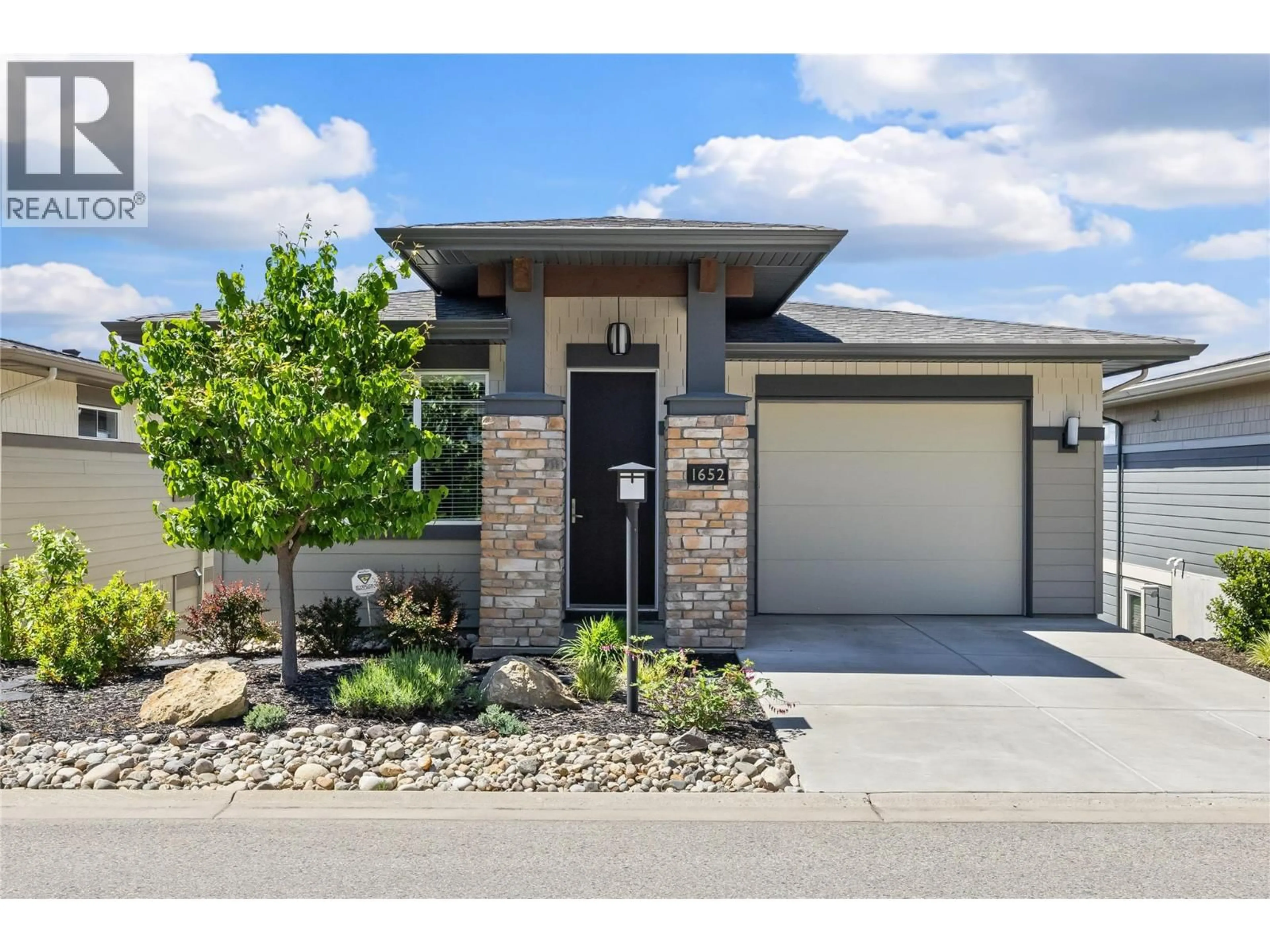 Home with brick exterior material, street for 1652 TOWER RANCH DRIVE, Kelowna British Columbia V1P1T8