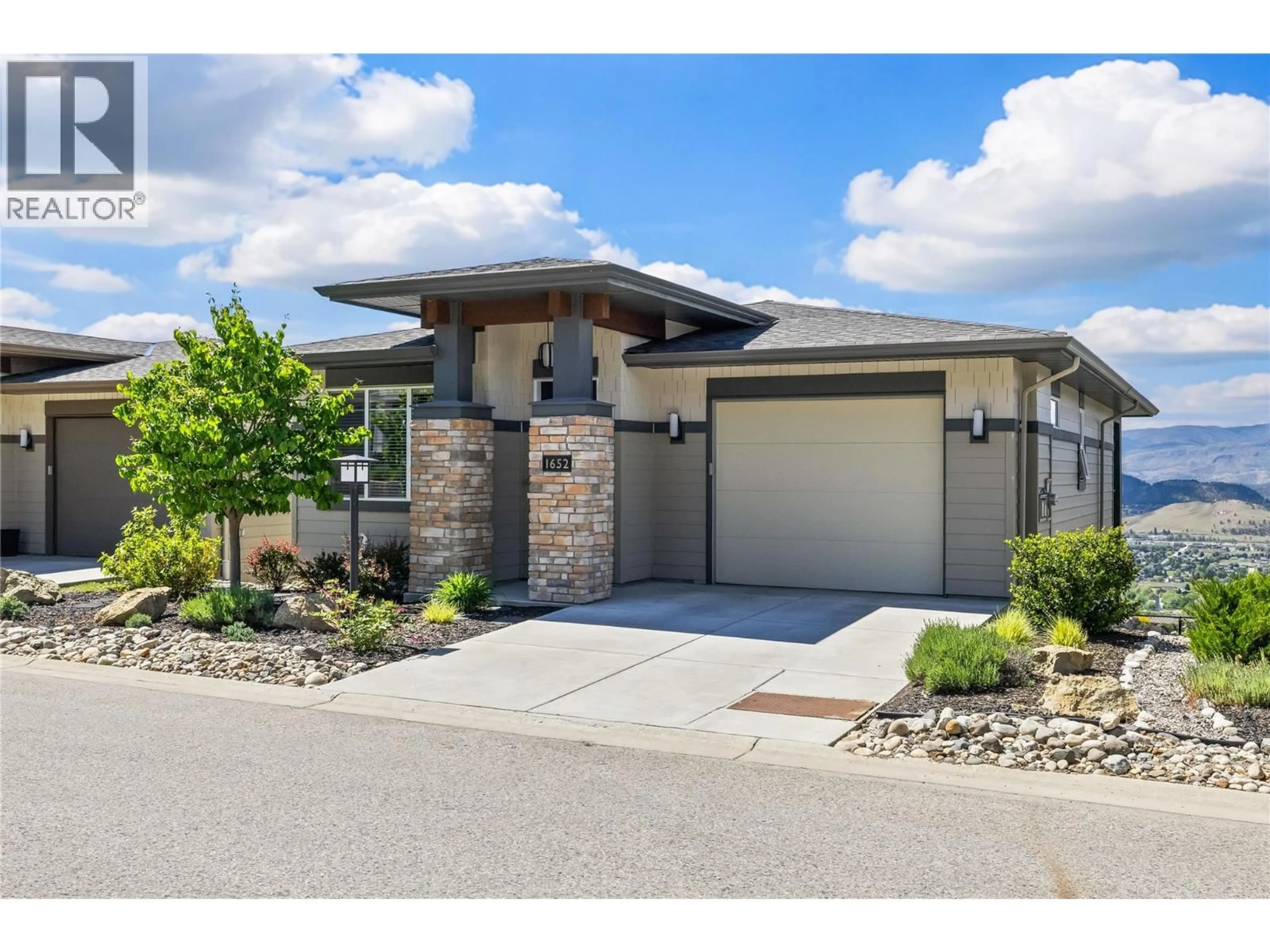 Home with brick exterior material, street for 1652 TOWER RANCH DRIVE, Kelowna British Columbia V1P1T8