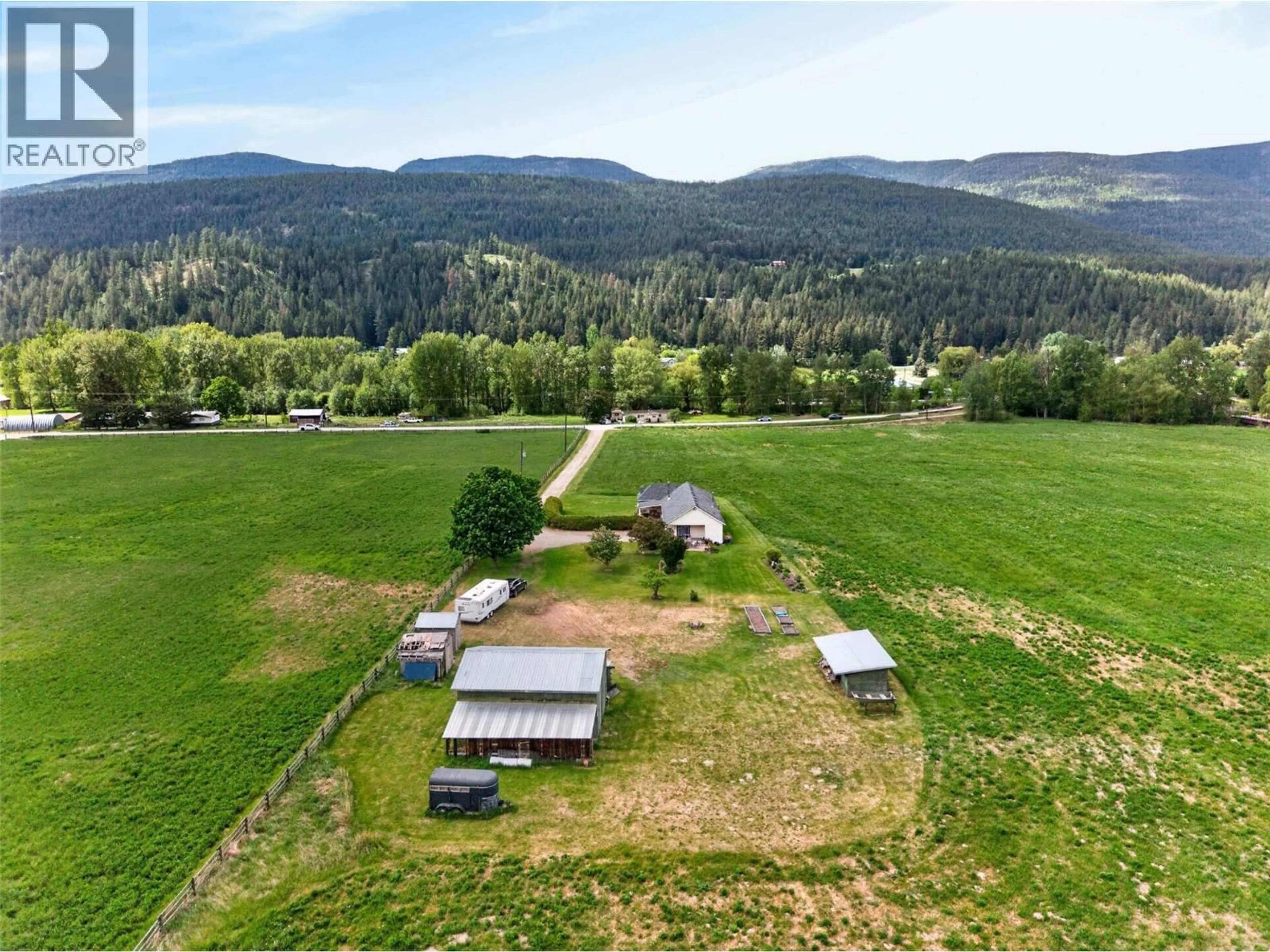 A pic from outside/outdoor area/front of a property/back of a property/a pic from drone, mountain view for 1403 SALMON RIVER ROAD, Salmon Arm British Columbia V1E3H3