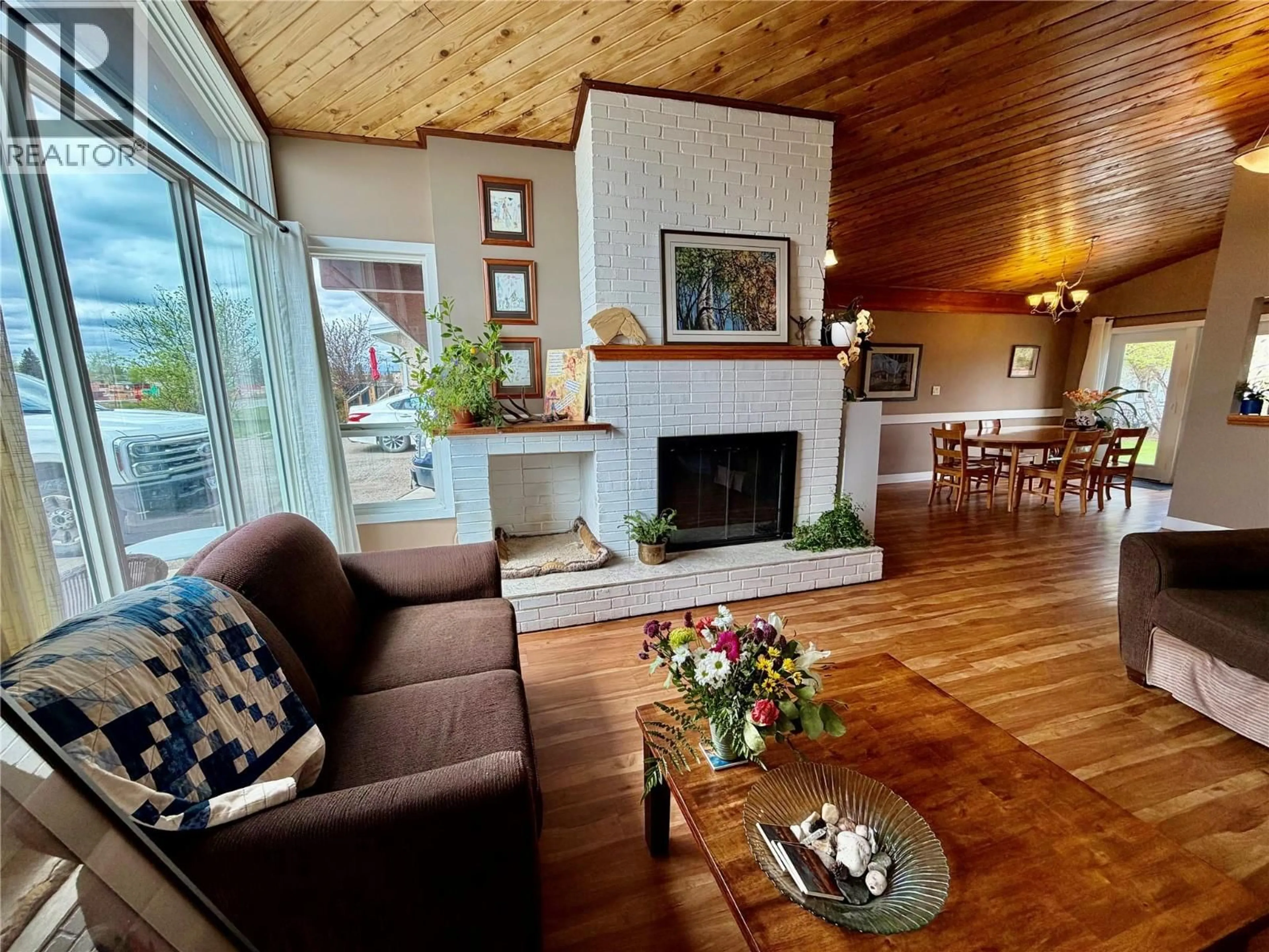 Living room with furniture, wood/laminate floor for 924 112 AVENUE, Dawson Creek British Columbia V1G2Y3