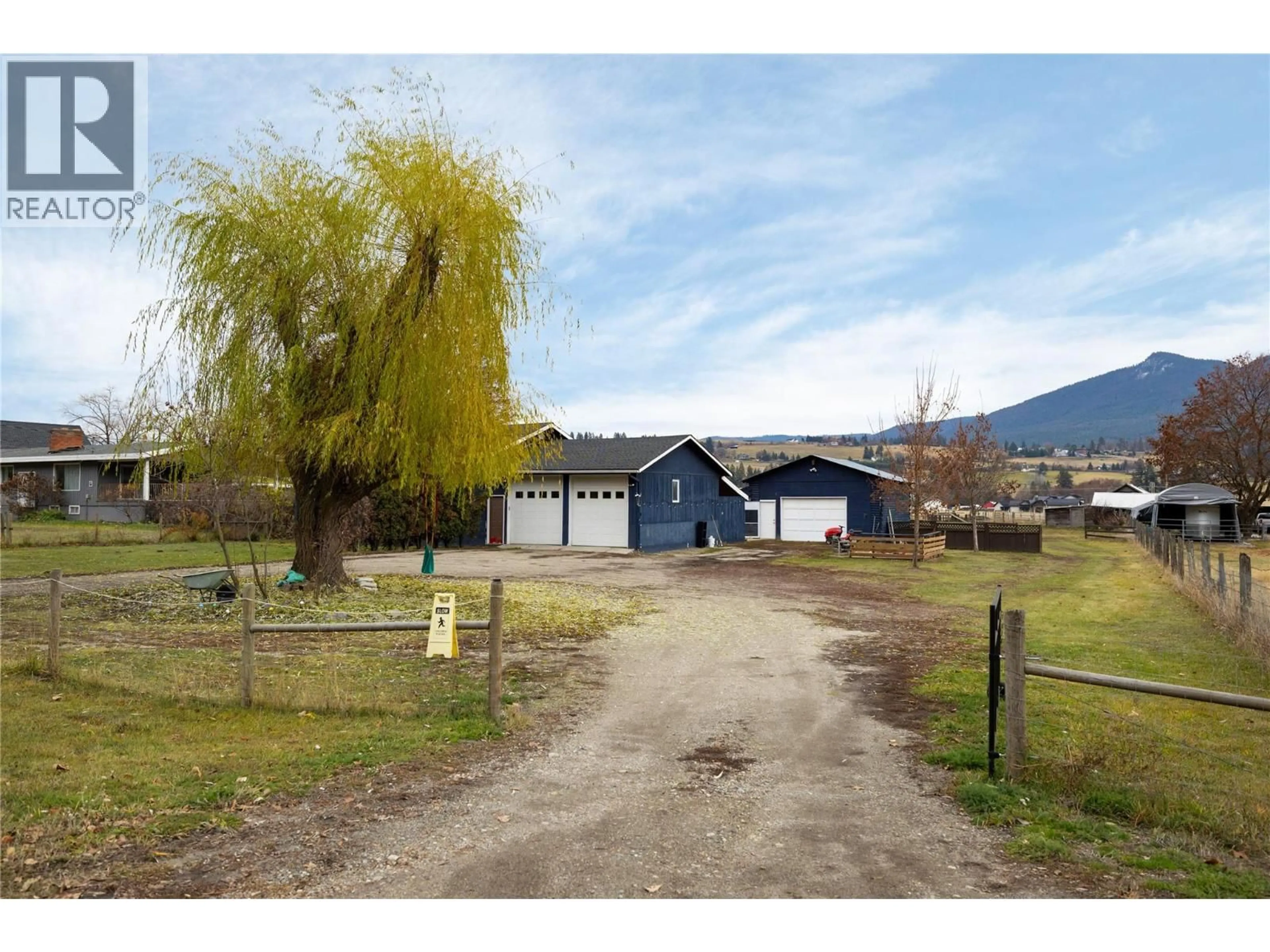 A pic from outside/outdoor area/front of a property/back of a property/a pic from drone, mountain view for 5712 6 HIGHWAY, Vernon British Columbia V1B3E1