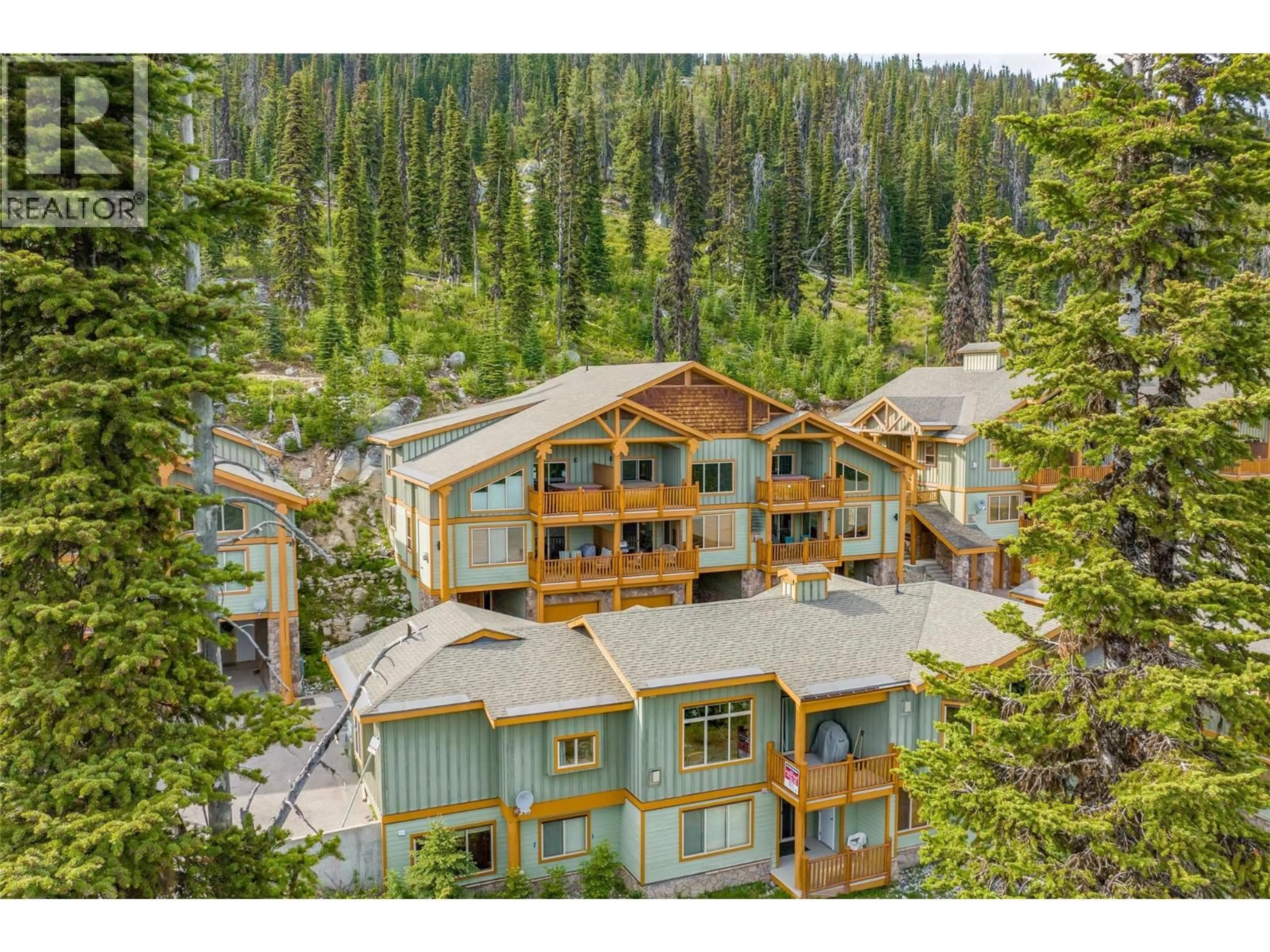 A pic from outside/outdoor area/front of a property/back of a property/a pic from drone, forest/trees view for 8 - 5940 SNOW PINES WAY, Big White British Columbia V1P1P3