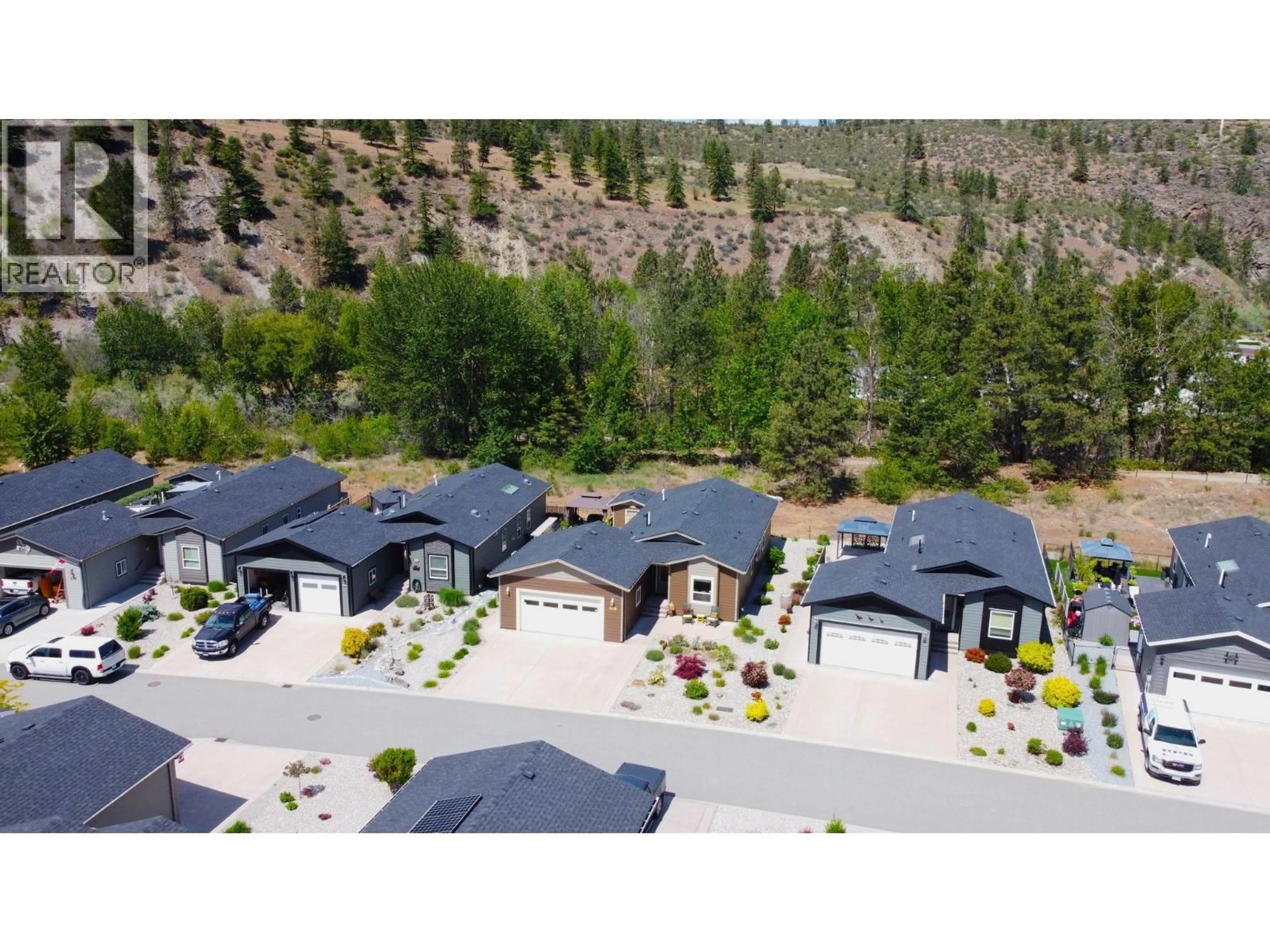 A pic from outside/outdoor area/front of a property/back of a property/a pic from drone, mountain view for 108 - 8300 GALLAGHER LAKE FRONTAGE ROAD, Oliver British Columbia V0H1T2