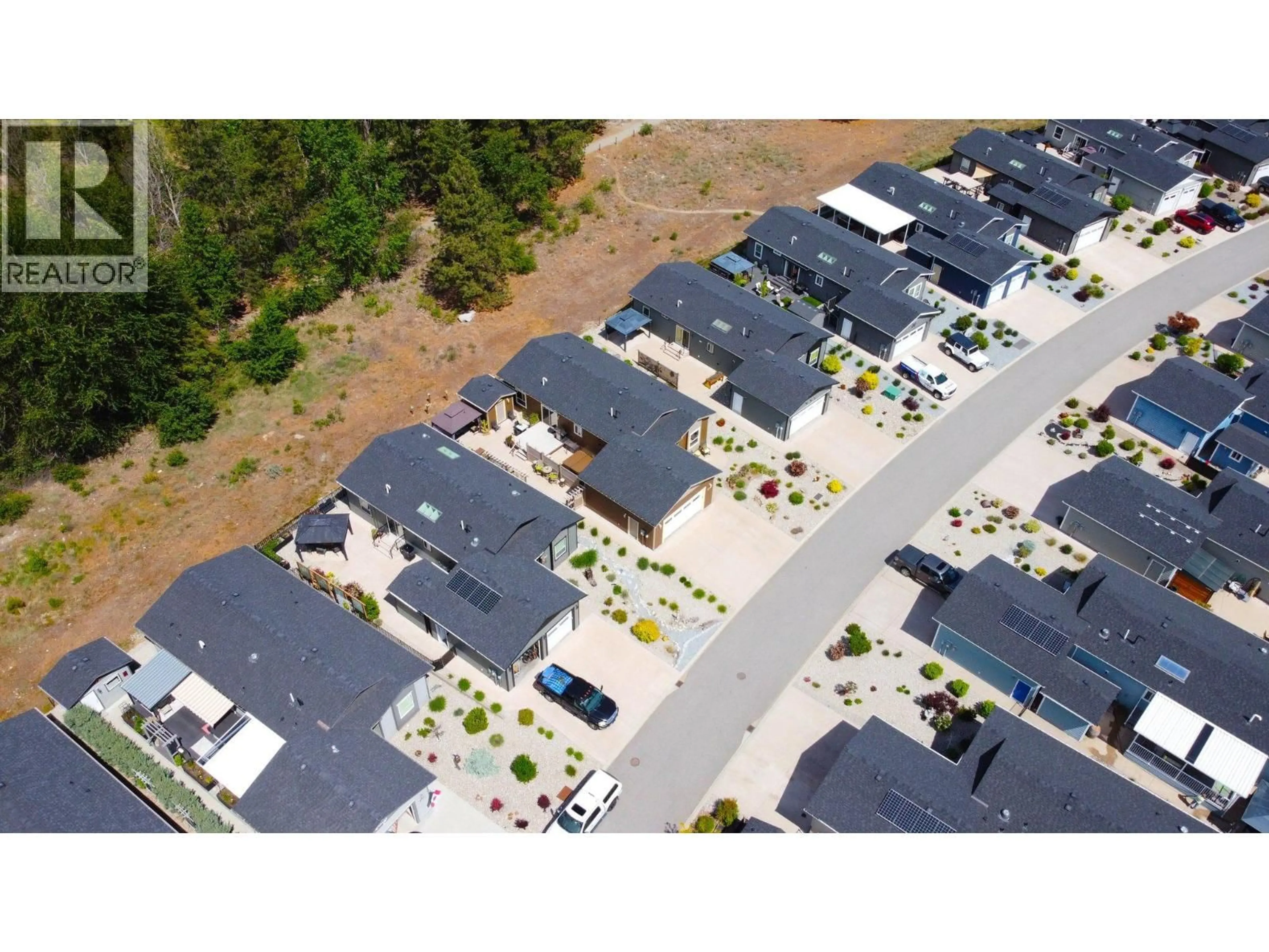 A pic from outside/outdoor area/front of a property/back of a property/a pic from drone, street for 108 - 8300 GALLAGHER LAKE FRONTAGE ROAD, Oliver British Columbia V0H1T2