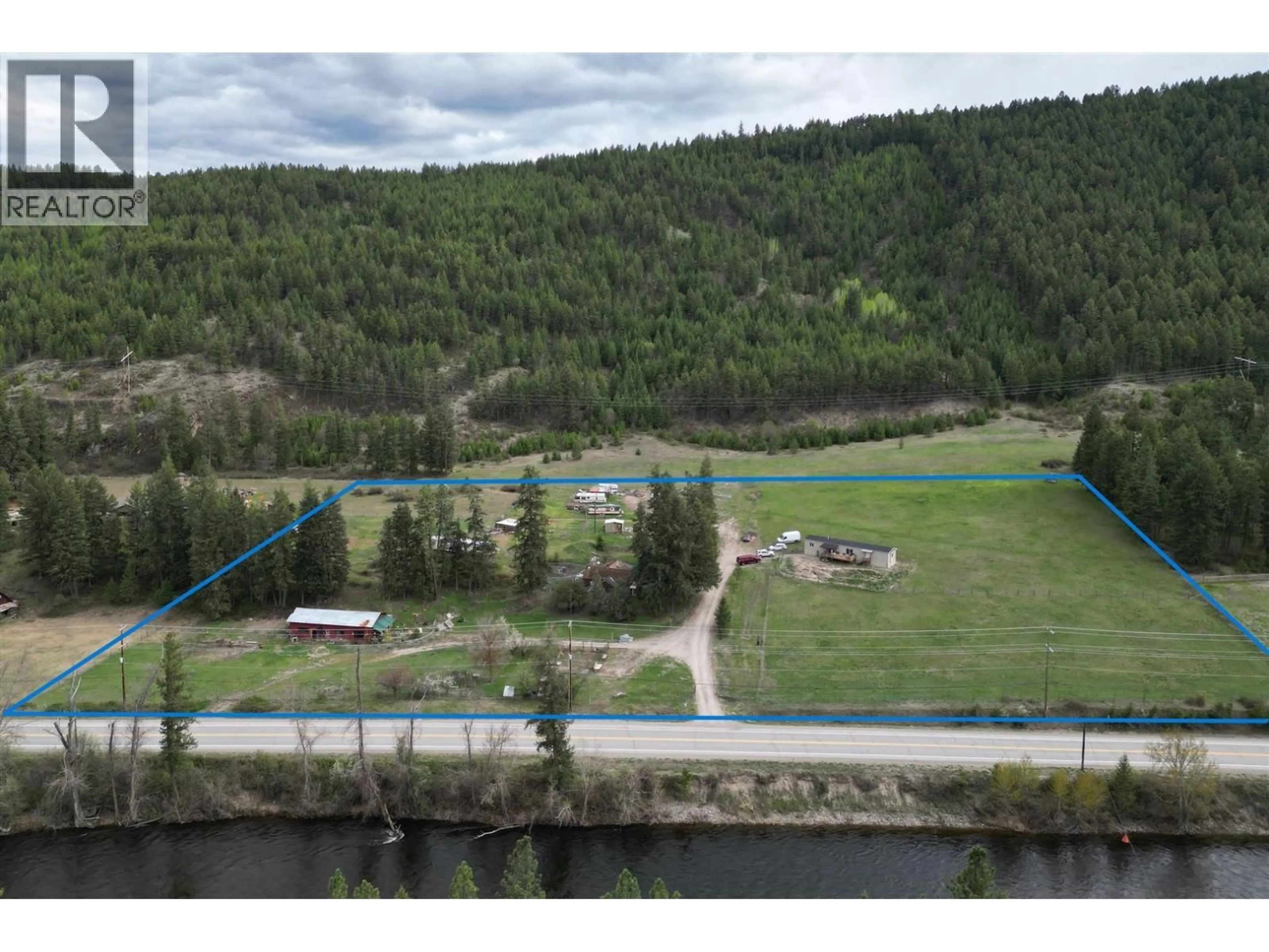 A pic from outside/outdoor area/front of a property/back of a property/a pic from drone, water/lake/river/ocean view for 3940 HIGHWAY 3 OTHER, Rock Creek British Columbia V0H1Y0