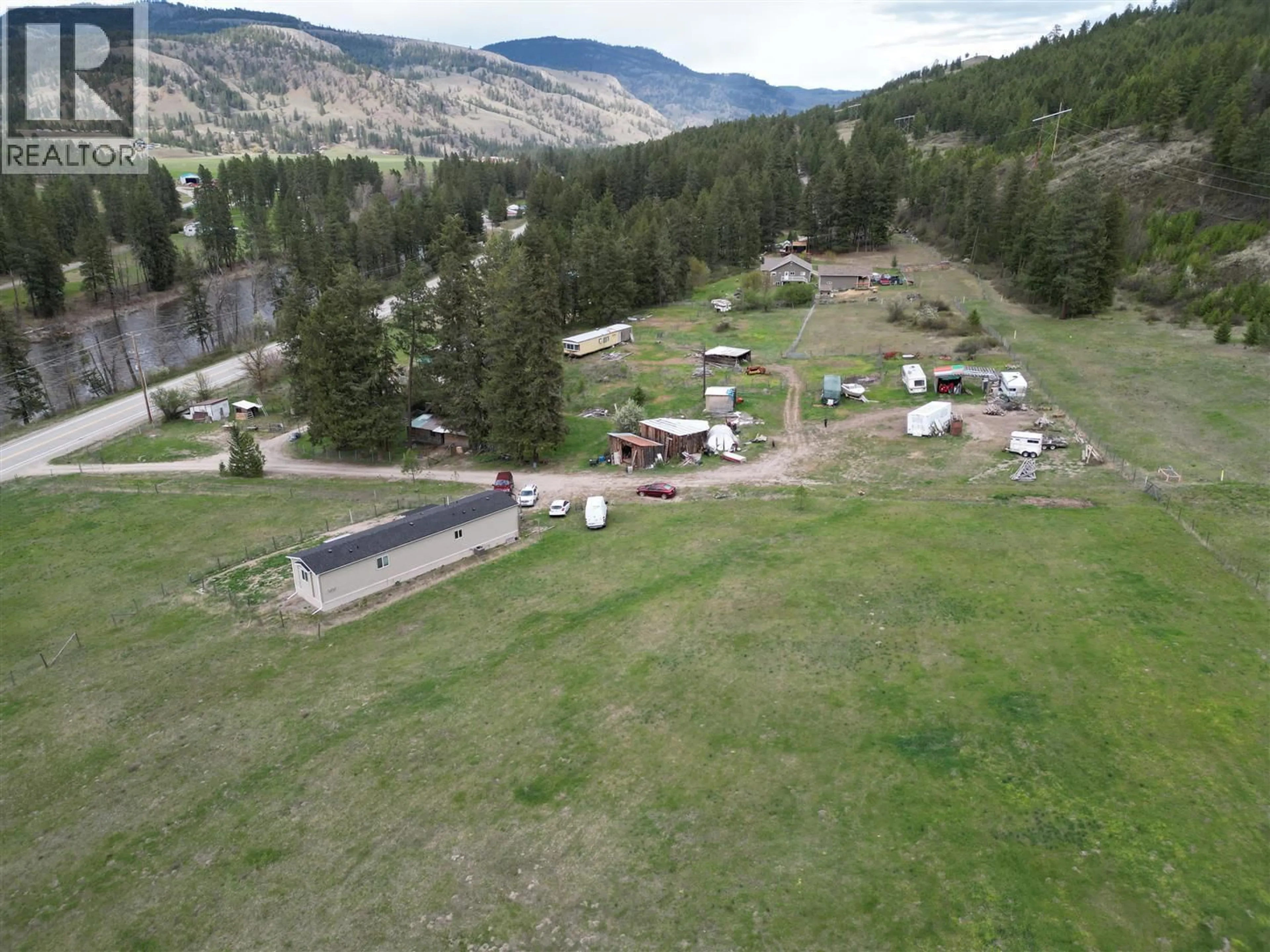A pic from outside/outdoor area/front of a property/back of a property/a pic from drone, mountain view for 3940 HIGHWAY 3 OTHER, Rock Creek British Columbia V0H1Y0