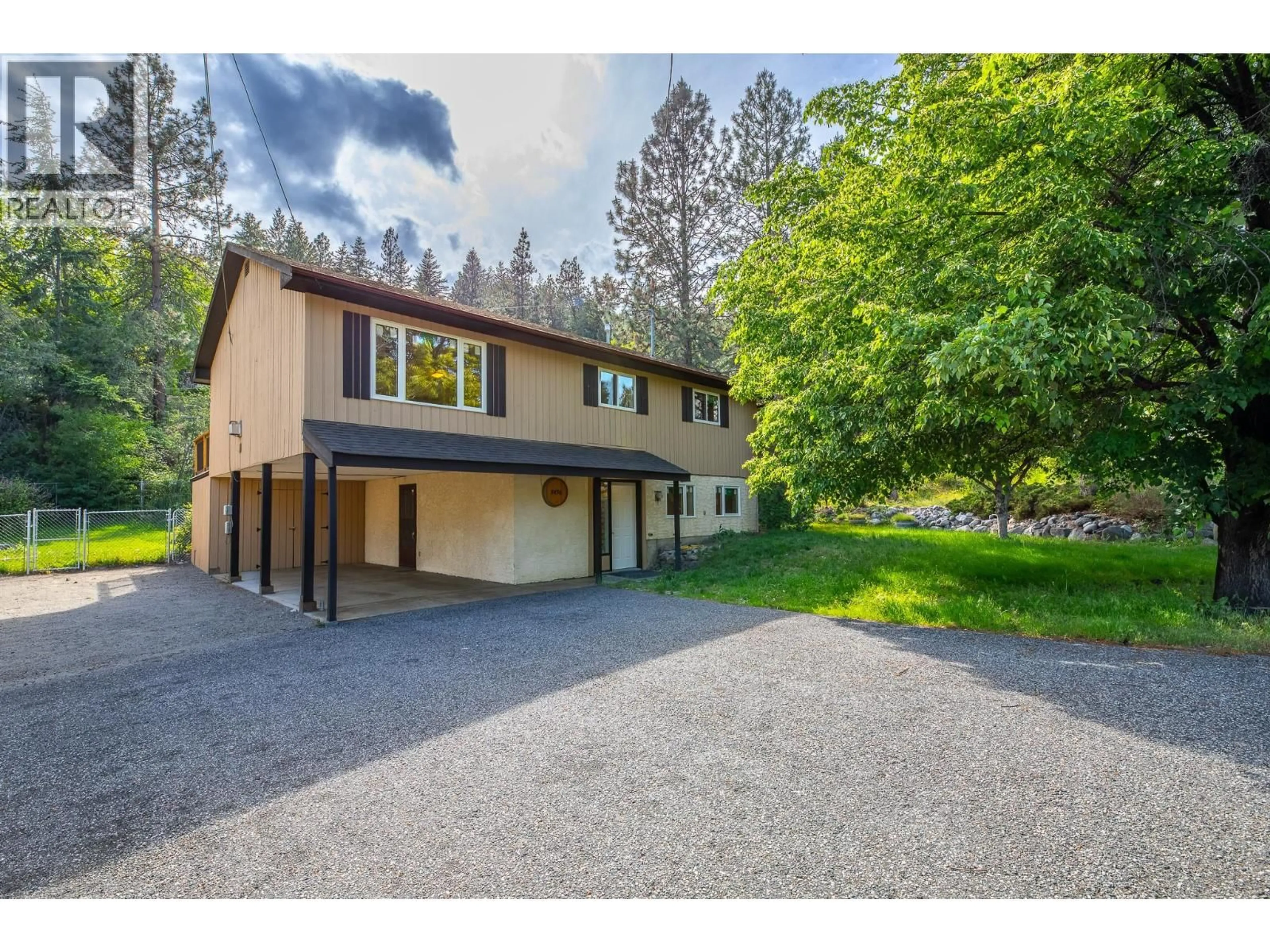 A pic from outside/outdoor area/front of a property/back of a property/a pic from drone, street for 3436 MCTAGGART ROAD, West Kelowna British Columbia V4T1H7