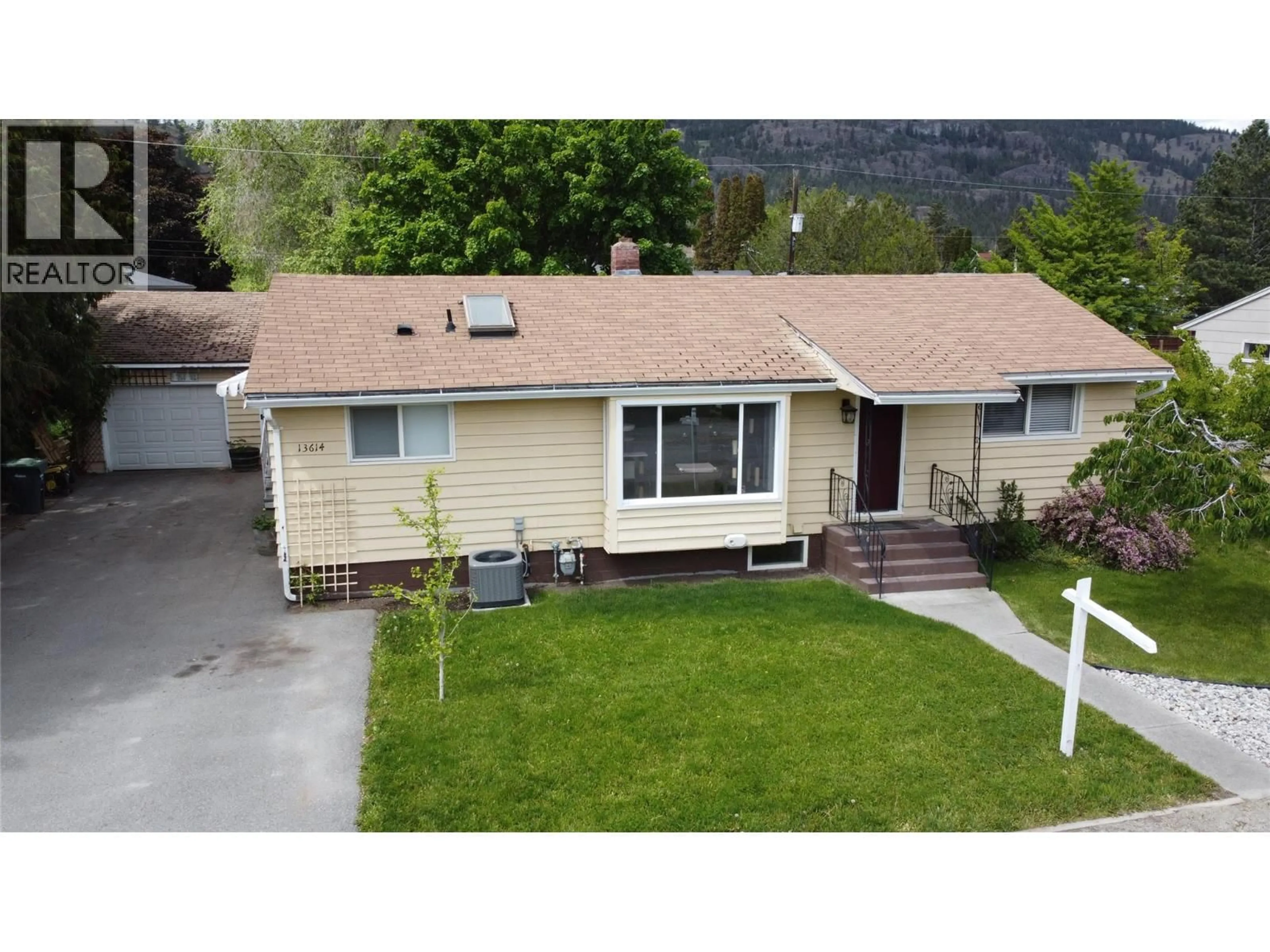 A pic from outside/outdoor area/front of a property/back of a property/a pic from drone, mountain view for 13614 SPENCER AVENUE, Summerland British Columbia V0H1Z0