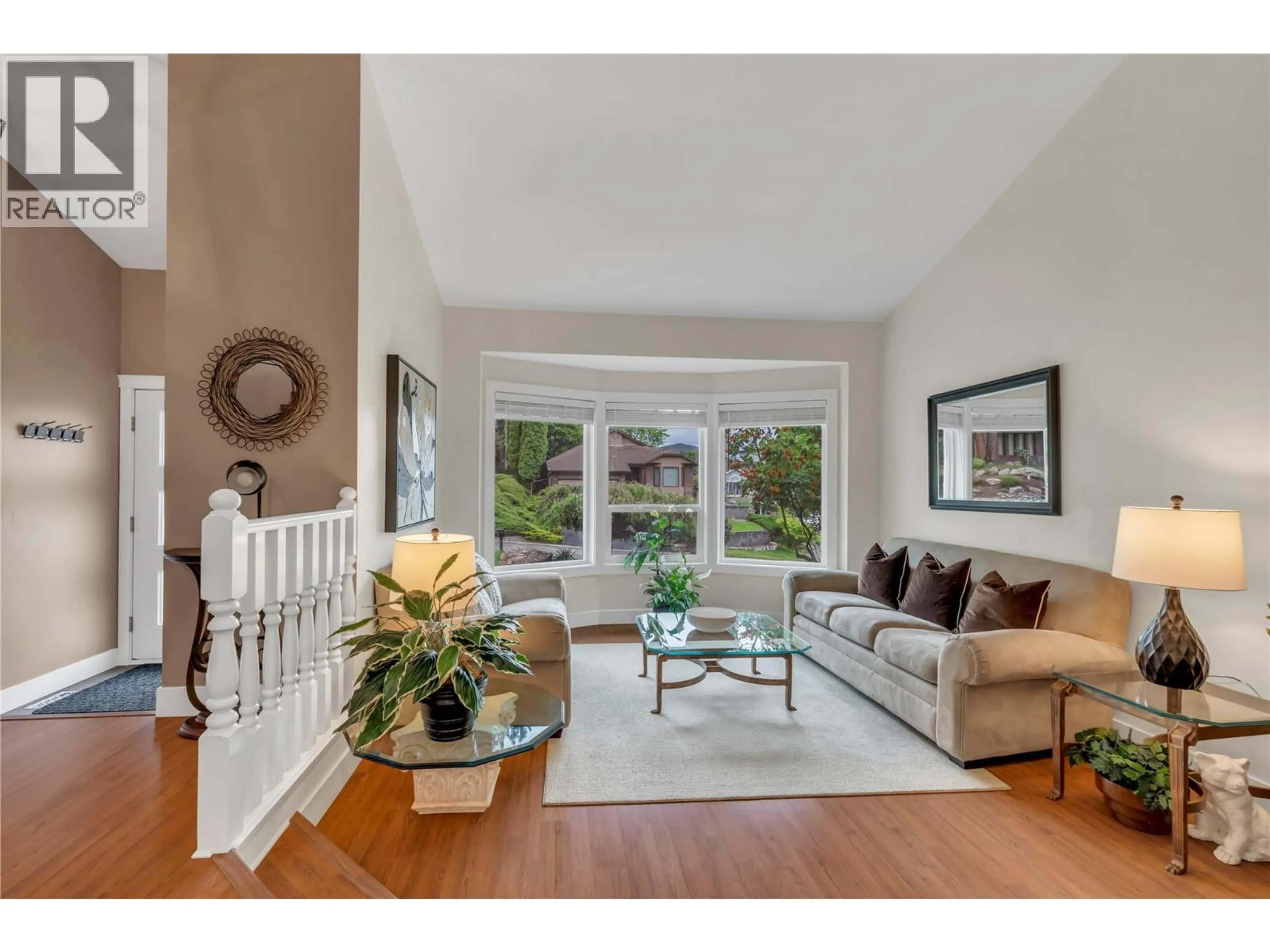 Living room with furniture, wood/laminate floor for 769 BALSAM AVENUE, Penticton British Columbia V2A7Y8