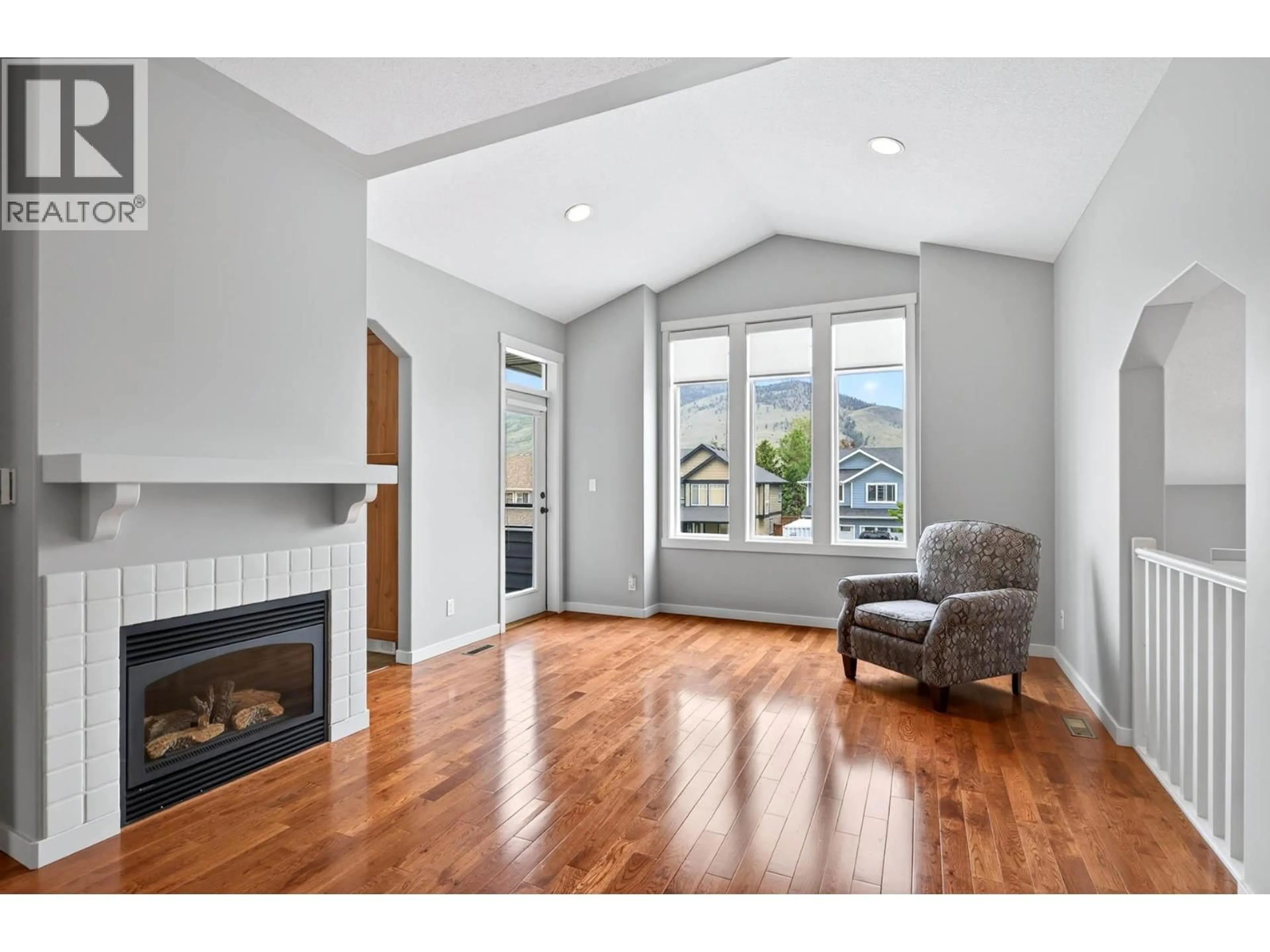 Living room with furniture, wood/laminate floor for 2155 CANTLE PLACE, Kamloops British Columbia V2B0A7