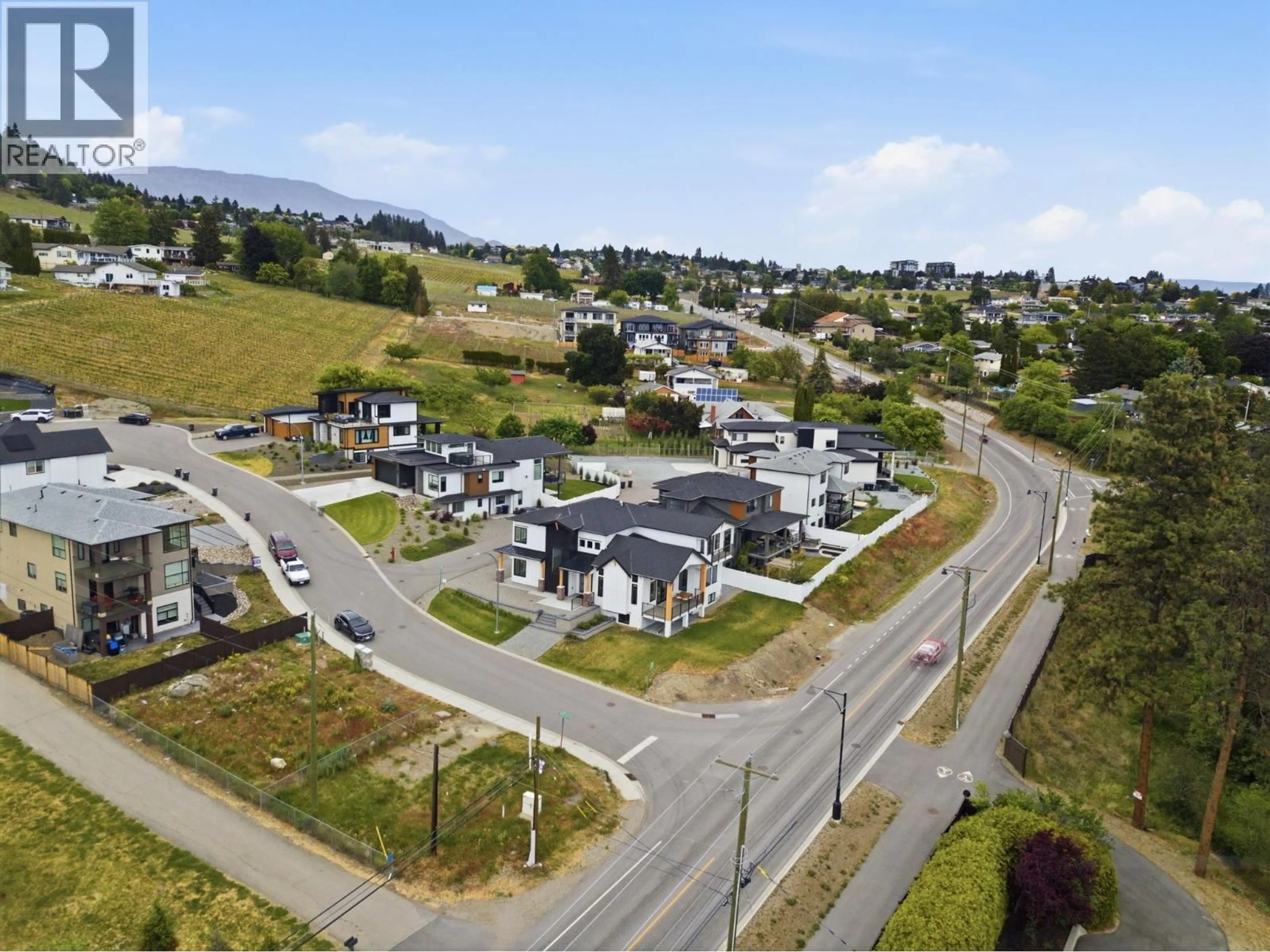 A pic from outside/outdoor area/front of a property/back of a property/a pic from drone, street for 1032 OAK BARREL LANE, West Kelowna British Columbia V1Z0A6