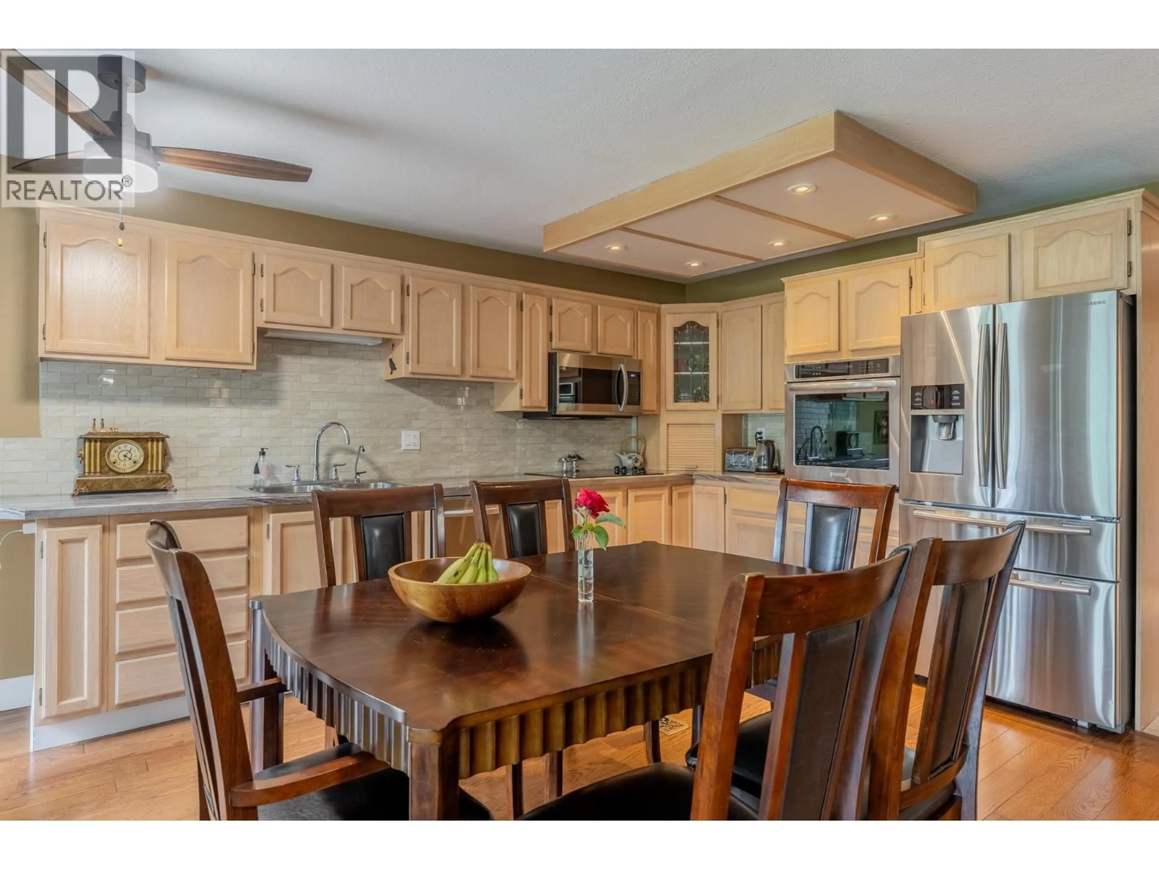 Open concept kitchen, wood/laminate floor for 1312 - 415 COMMONWEALTH ROAD, Kelowna British Columbia V4V1P4