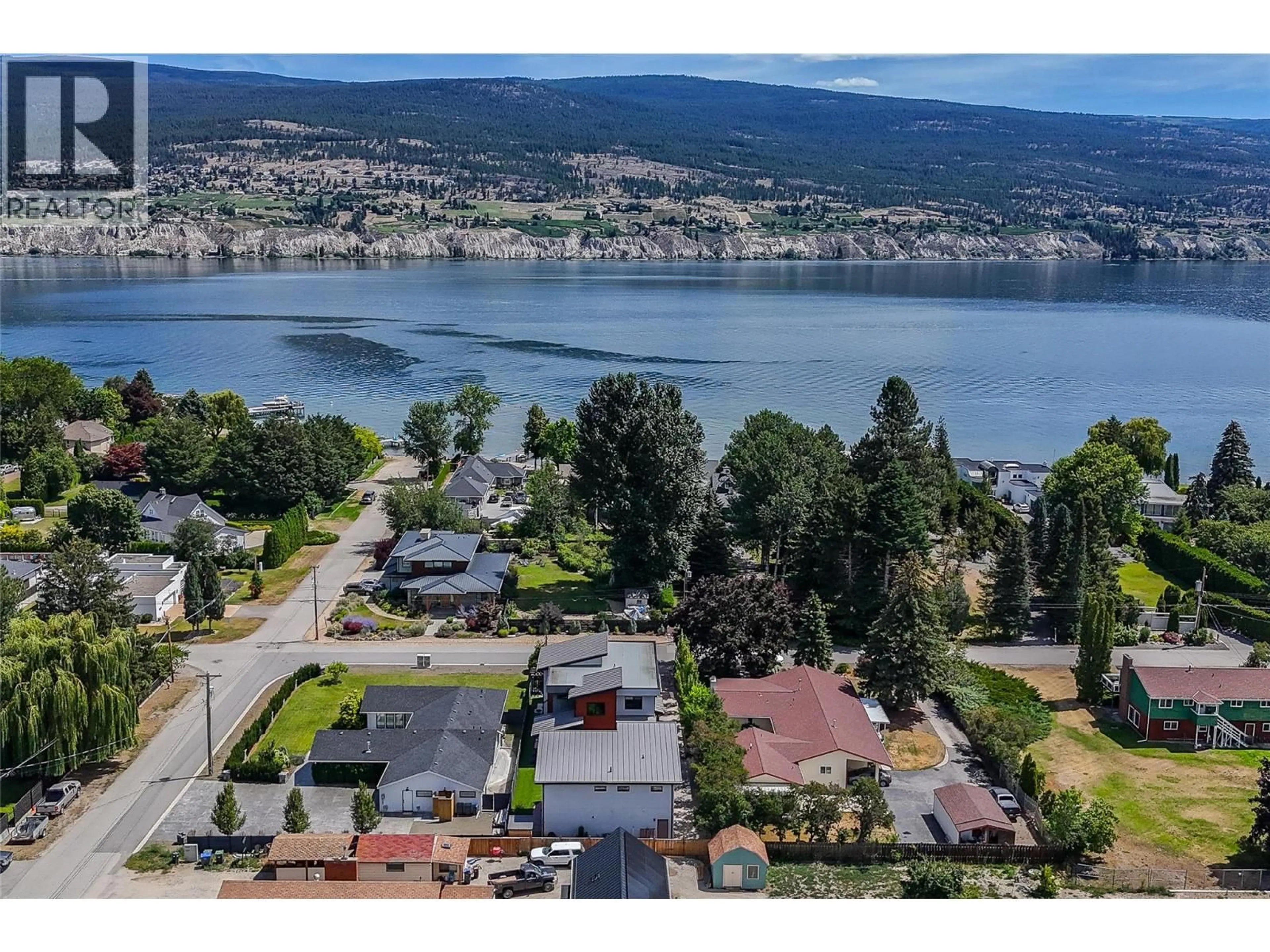 A pic from outside/outdoor area/front of a property/back of a property/a pic from drone, water/lake/river/ocean view for 5212 WOODS AVENUE, Summerland British Columbia V0H1Z9