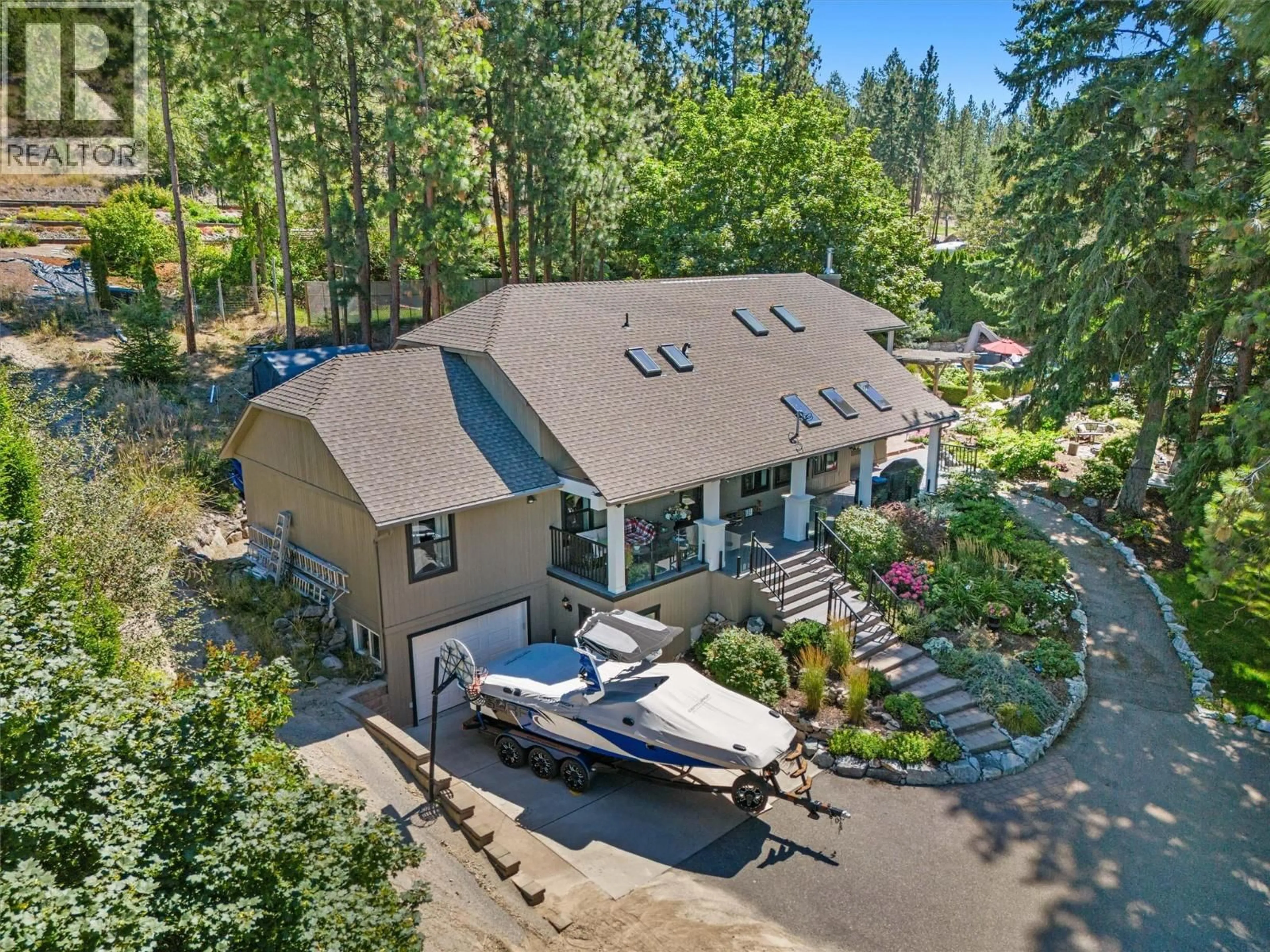 A pic from outside/outdoor area/front of a property/back of a property/a pic from drone, water/lake/river/ocean view for 13961 MOBERLY ROAD, Lake Country British Columbia V4V1A6
