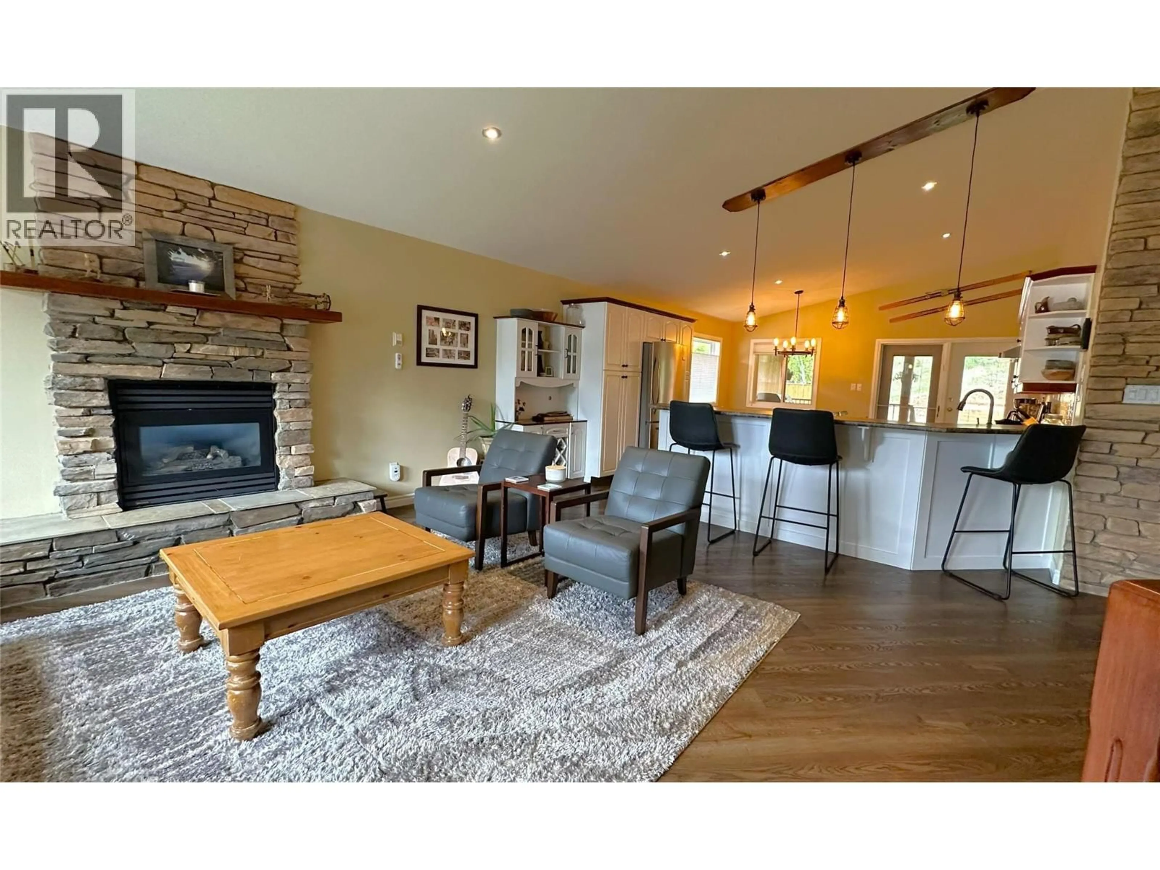 Living room with furniture, wood/laminate floor for 718 301ST STREET, Kimberley British Columbia V1A3K3
