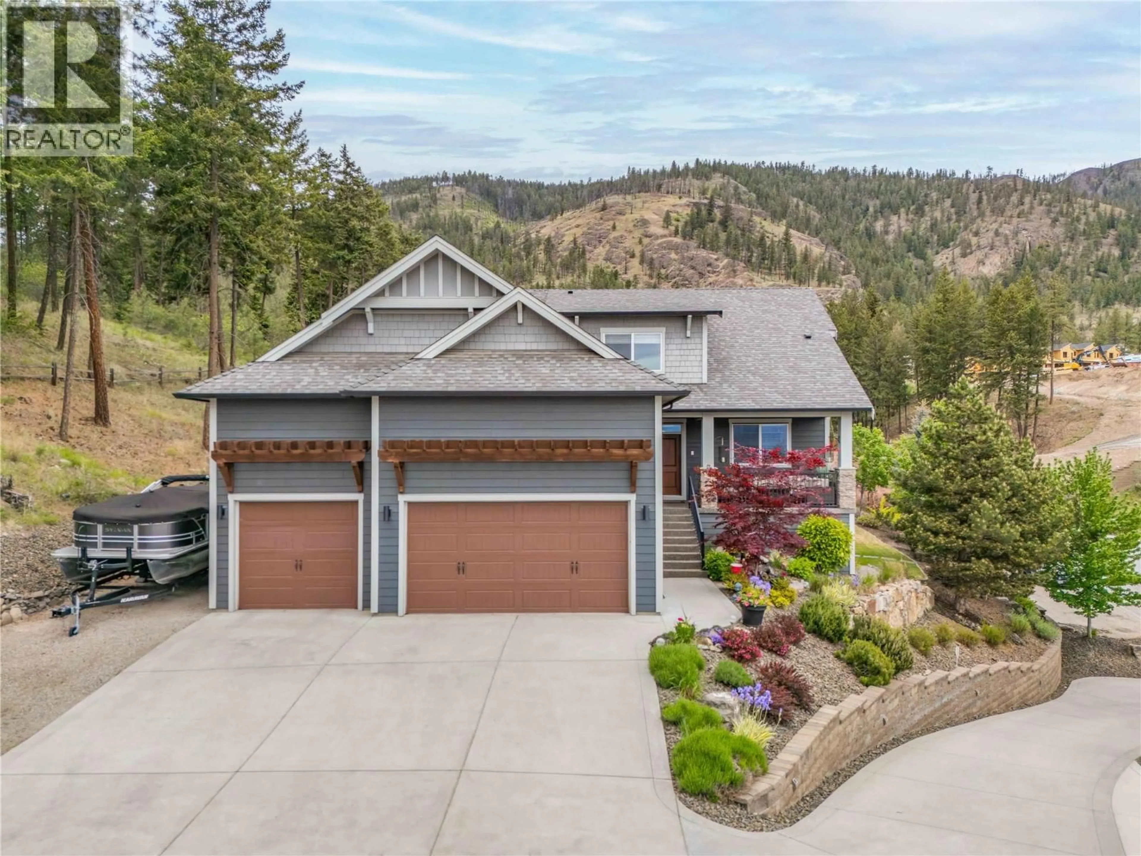 A pic from outside/outdoor area/front of a property/back of a property/a pic from drone, mountain view for 2410 MOUNTAINS HOLLOW LANE, West Kelowna British Columbia V4T3H5