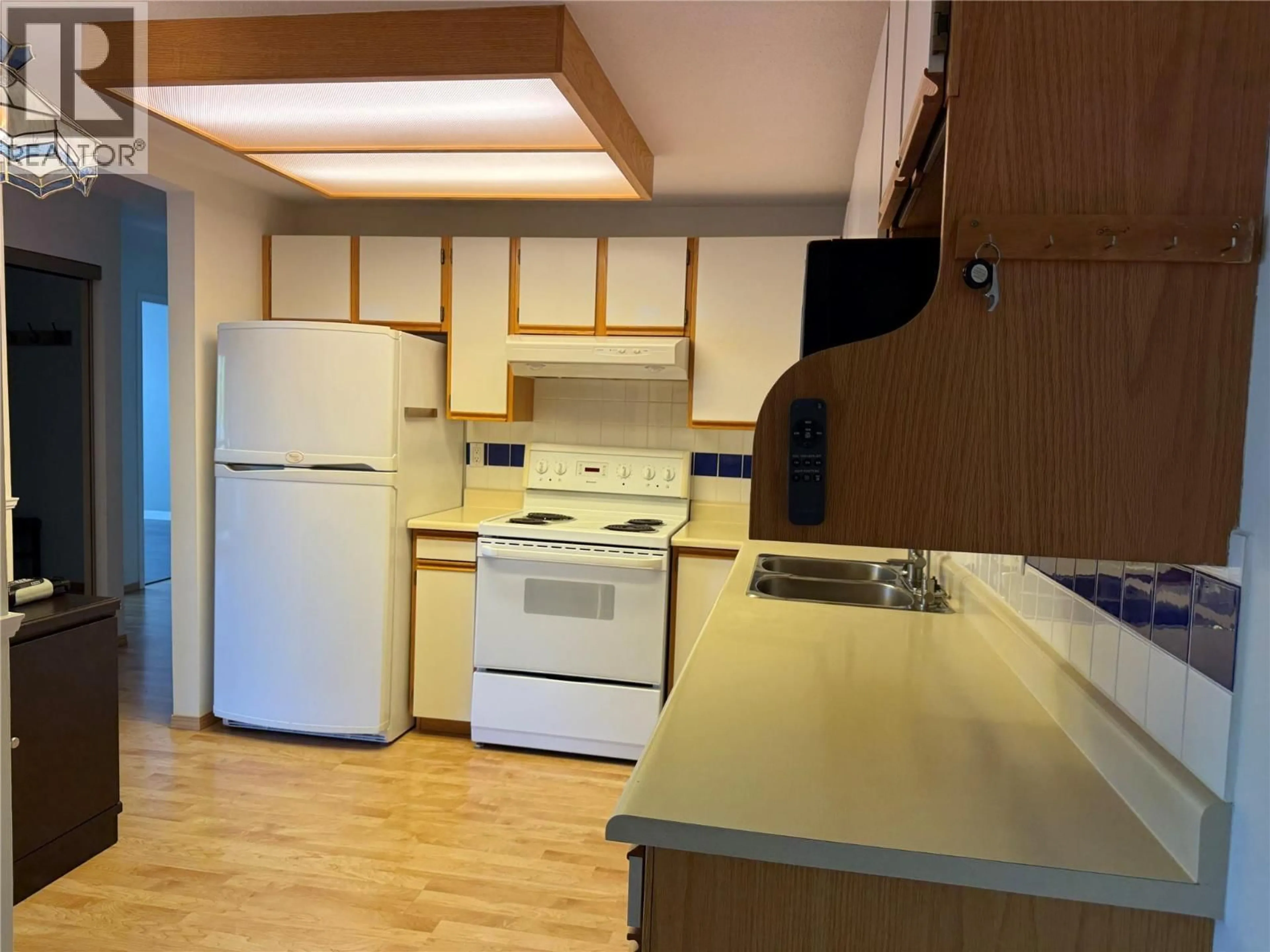 Standard kitchen, wood/laminate floor for 208 - 255 MCINTOSH ROAD, Kelowna British Columbia V1X2C5