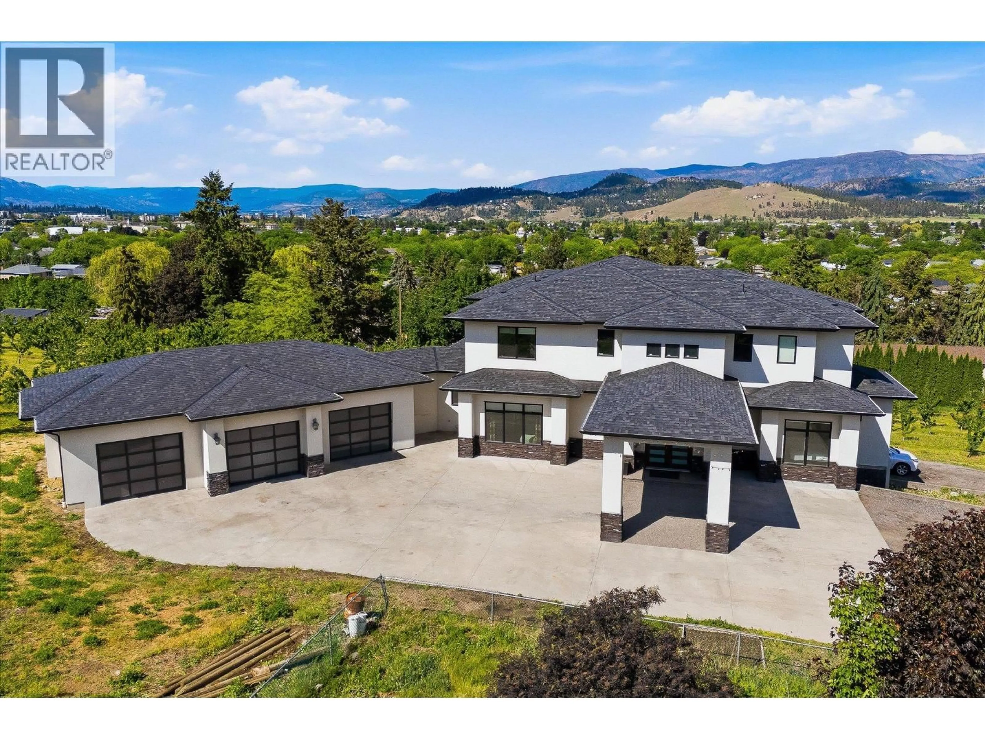 A pic from outside/outdoor area/front of a property/back of a property/a pic from drone, mountain view for 781 WALLACE ROAD, Kelowna British Columbia V1X4T5