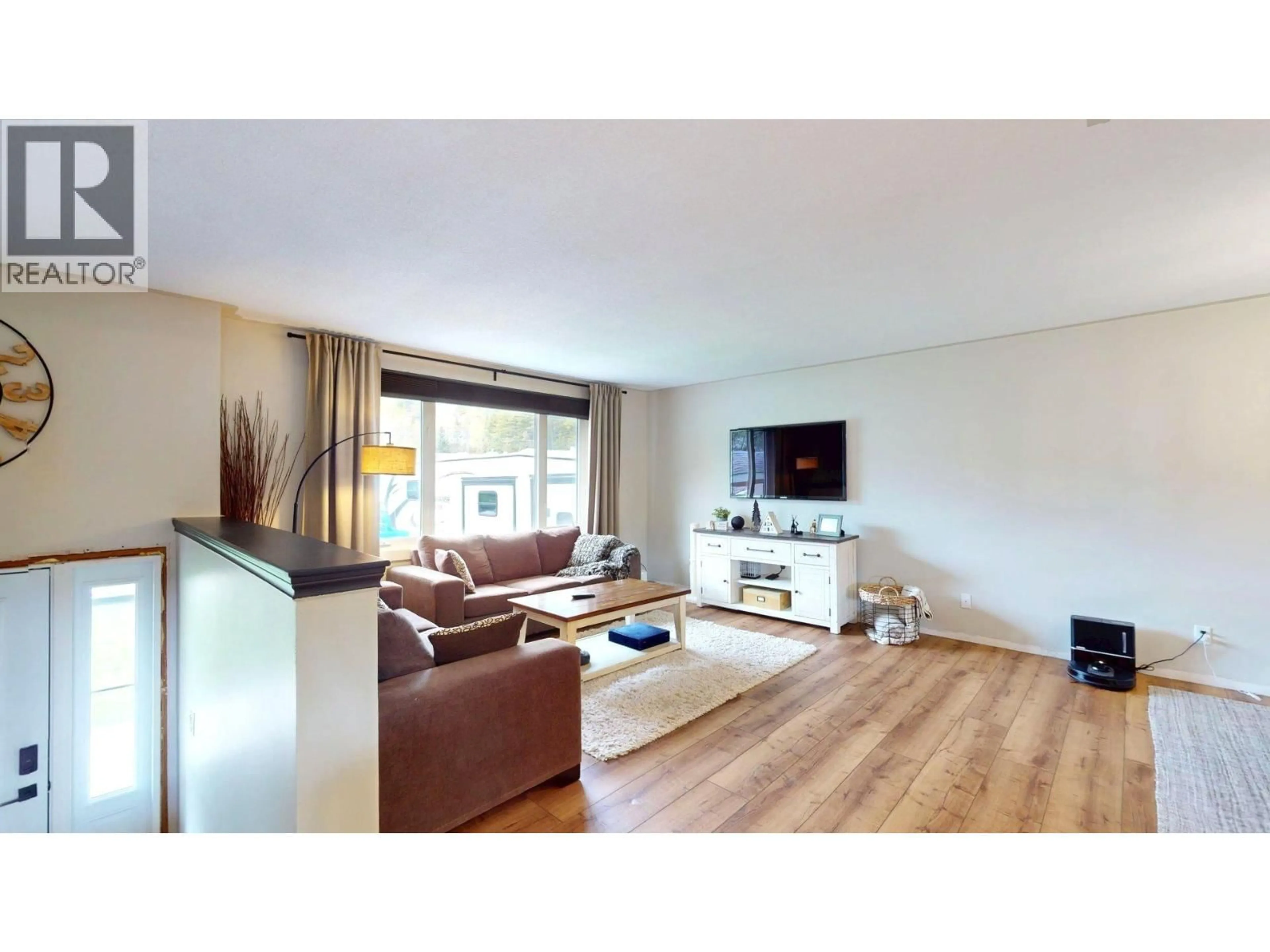 Living room with furniture, wood/laminate floor for 1162 NASHTON CRESCENT, Elkford British Columbia V0B1H0