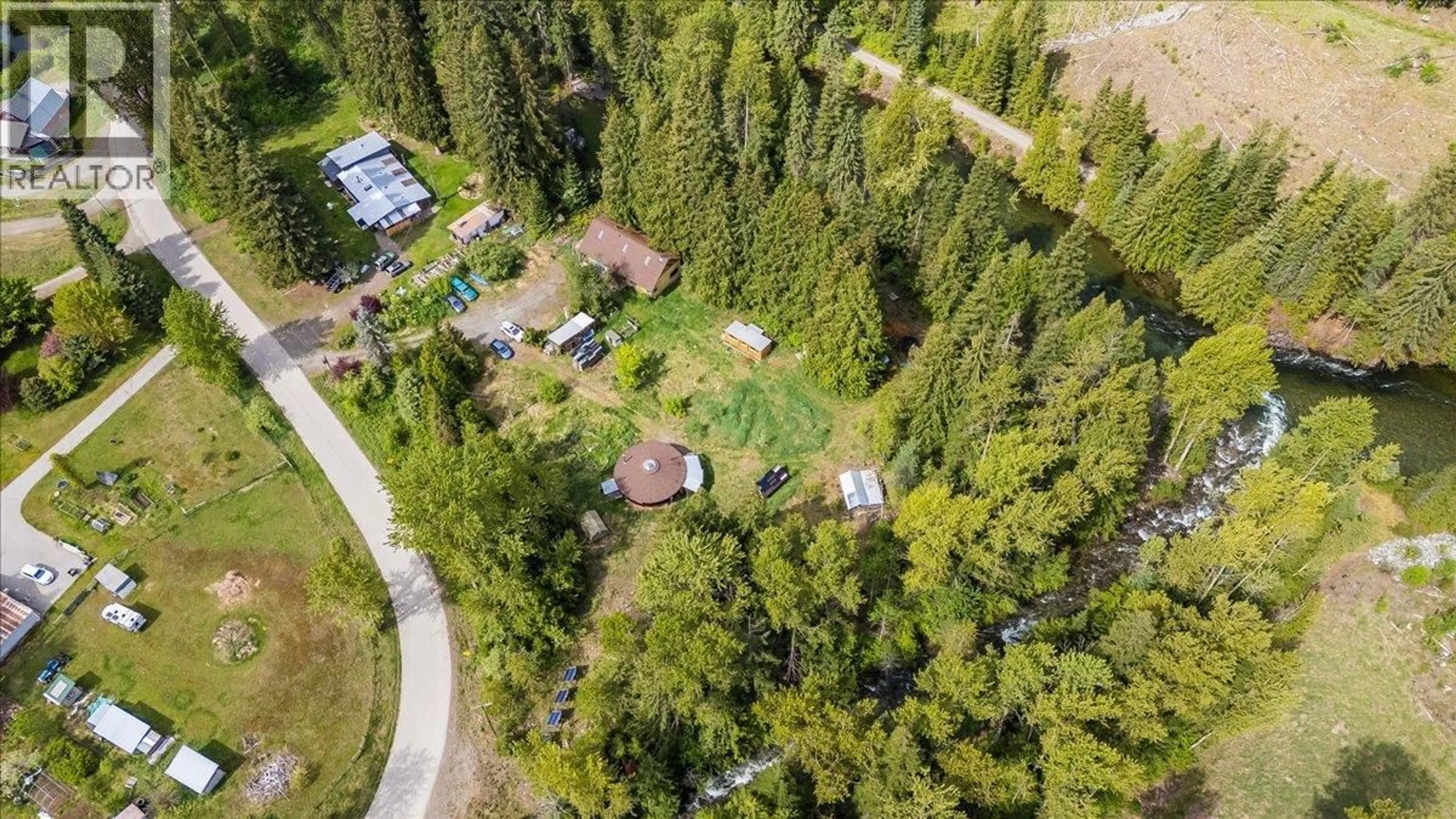 A pic from outside/outdoor area/front of a property/back of a property/a pic from drone, forest/trees view for 216 PORCUPINE CREEK ROAD, Ymir British Columbia V0G2K0