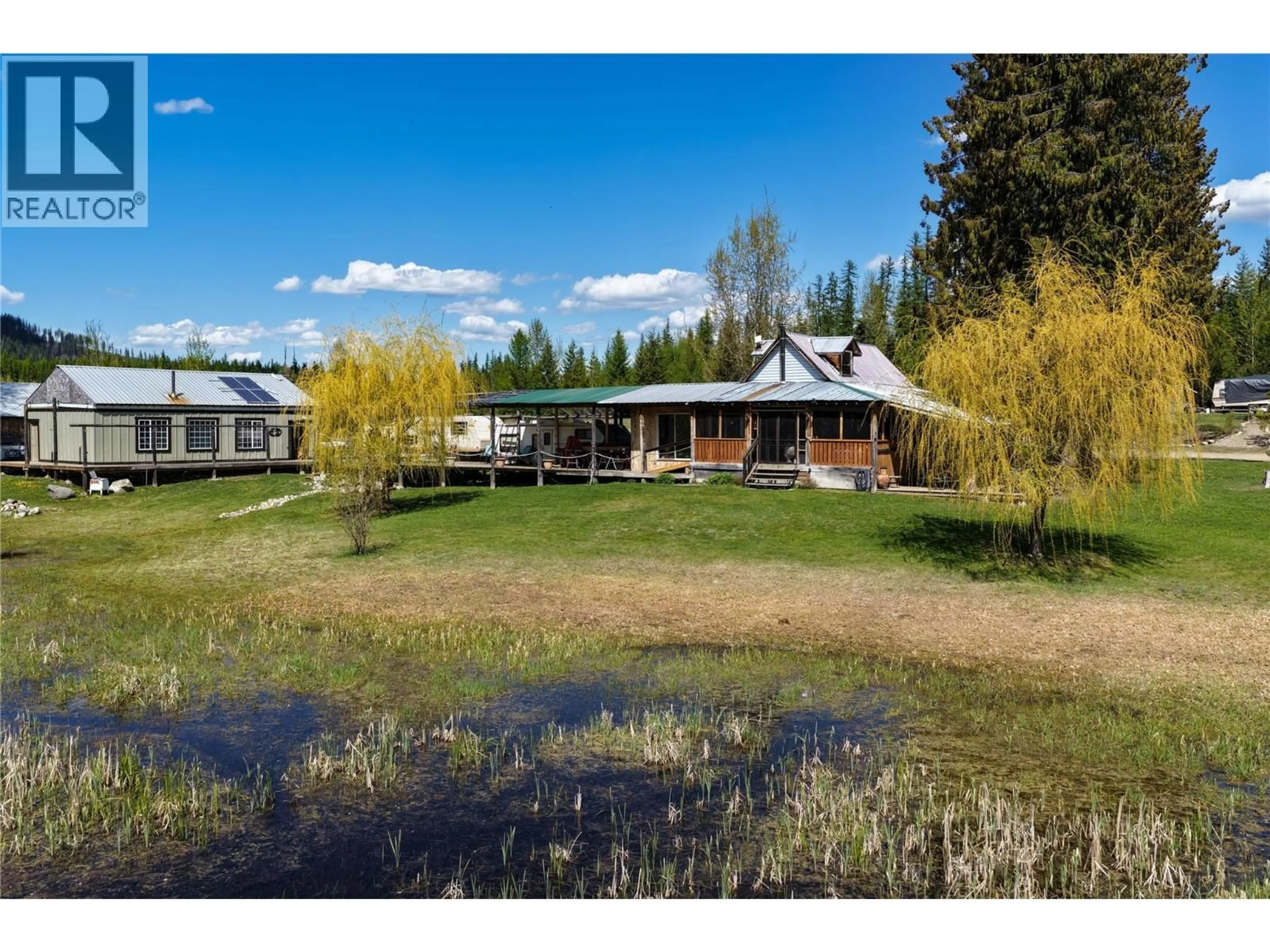 A pic from outside/outdoor area/front of a property/back of a property/a pic from drone, unknown for 650 TRINITY VALLEY ROAD, Lumby British Columbia V0E2G4
