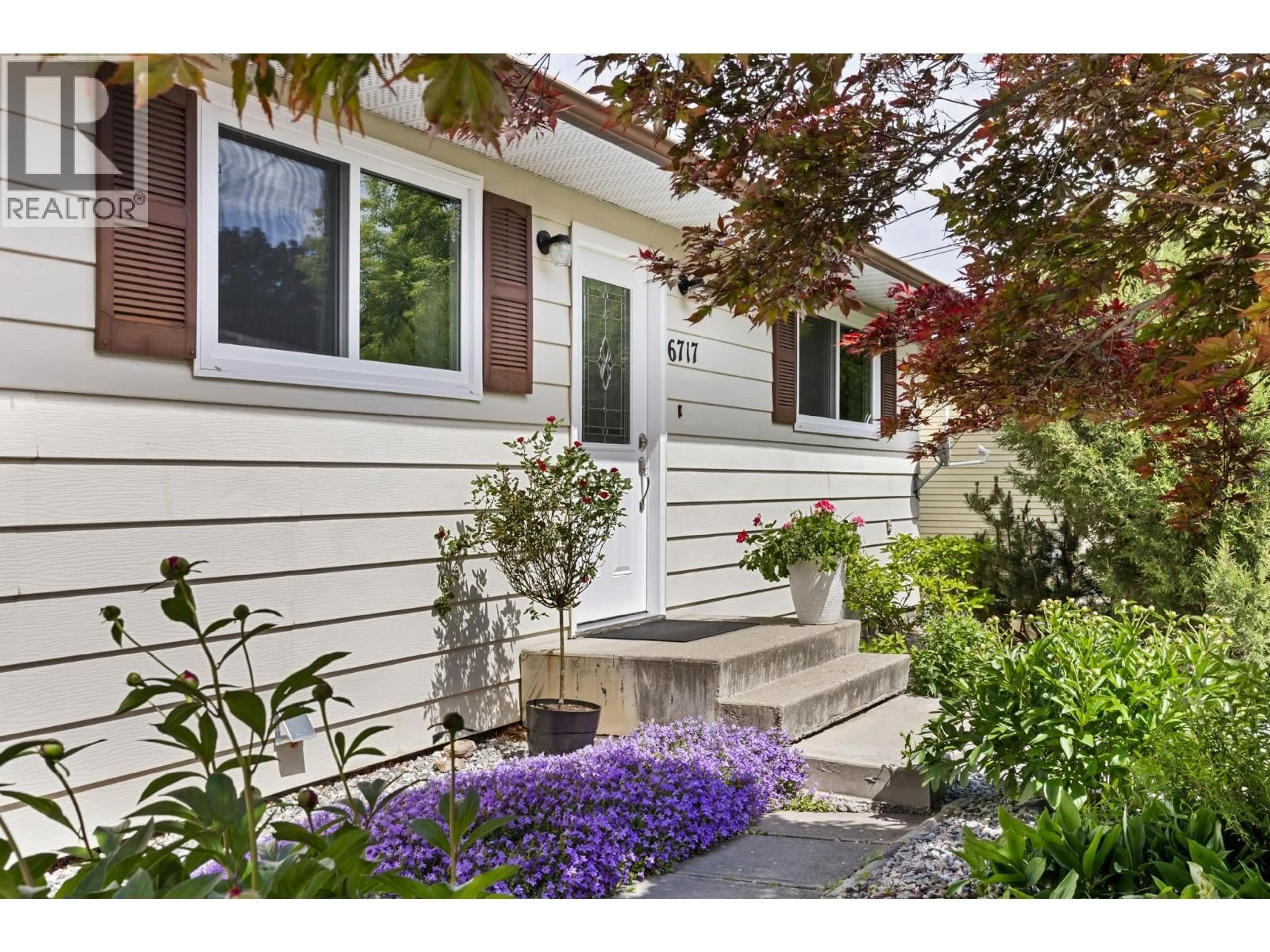 Home with vinyl exterior material, street for 6717 APOLLO ROAD, Vernon British Columbia V1H1J3