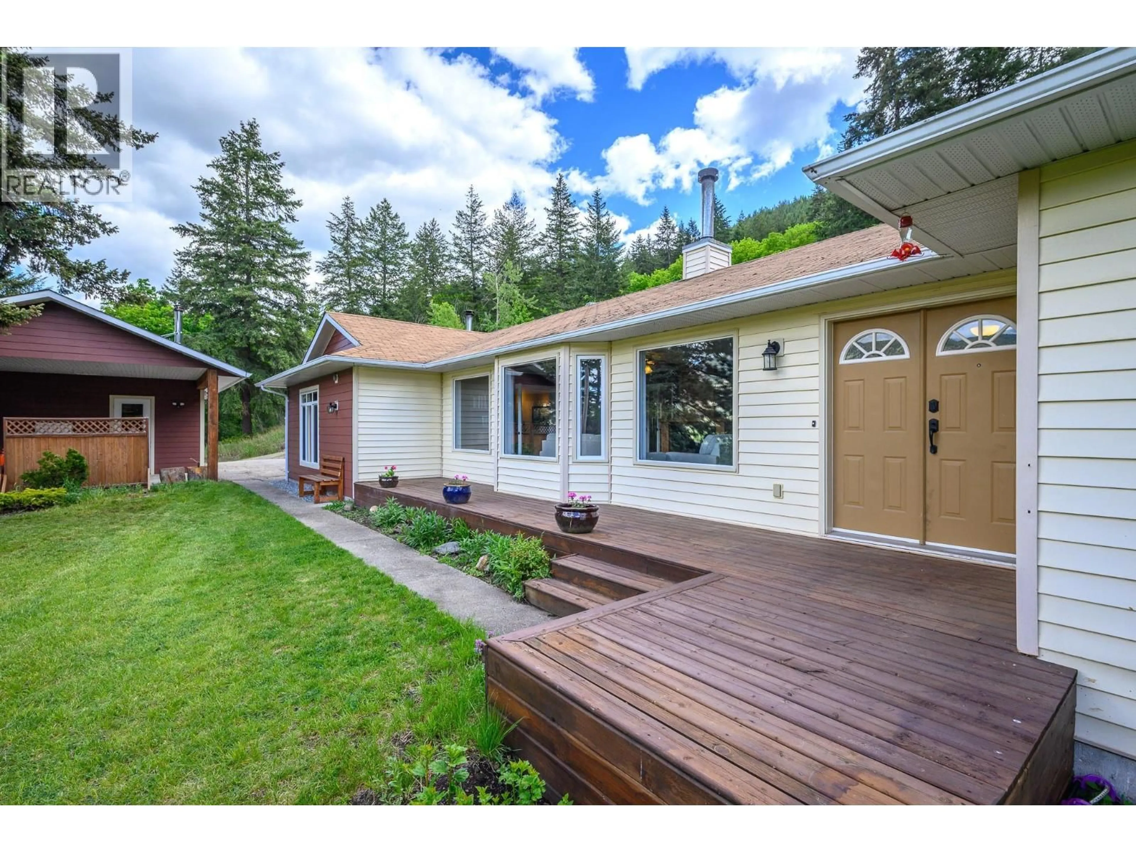 Home with vinyl exterior material, street for 6960 BREWER ROAD, Coldstream British Columbia V1B3H2