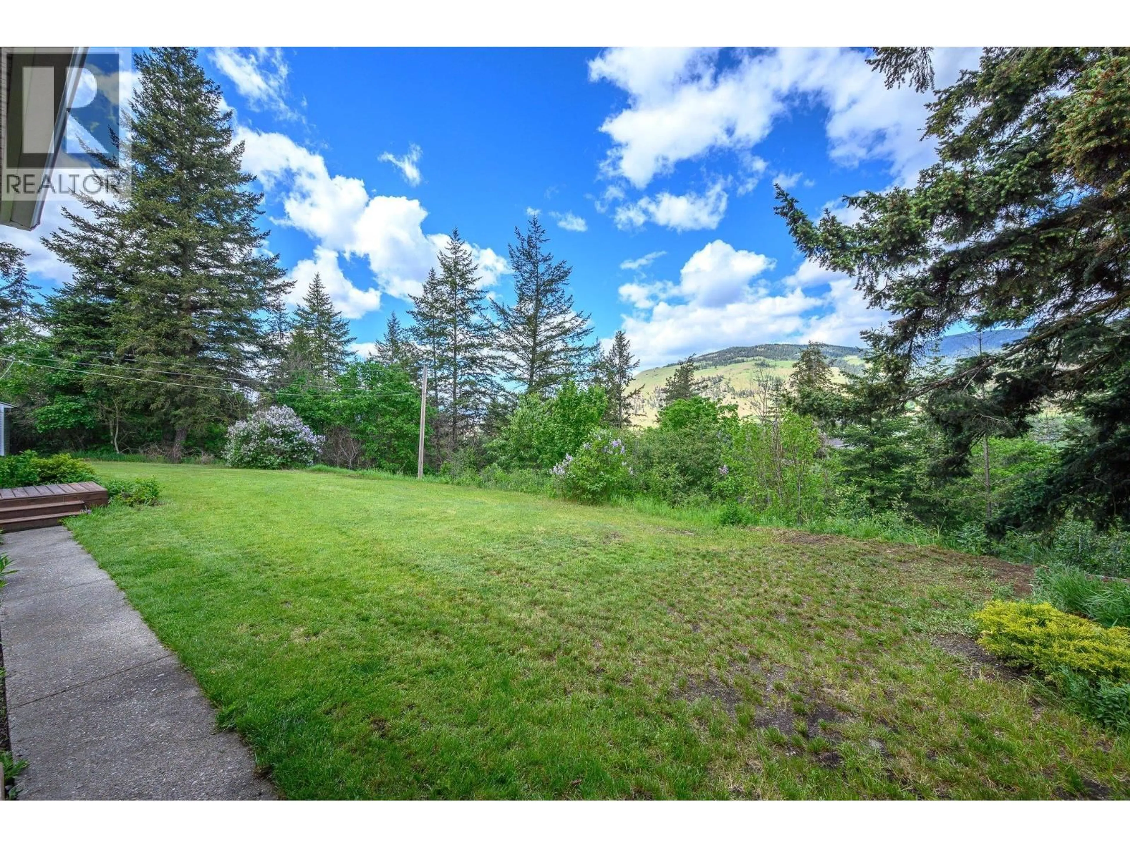 A pic from outside/outdoor area/front of a property/back of a property/a pic from drone, forest/trees view for 6960 BREWER ROAD, Coldstream British Columbia V1B3H2