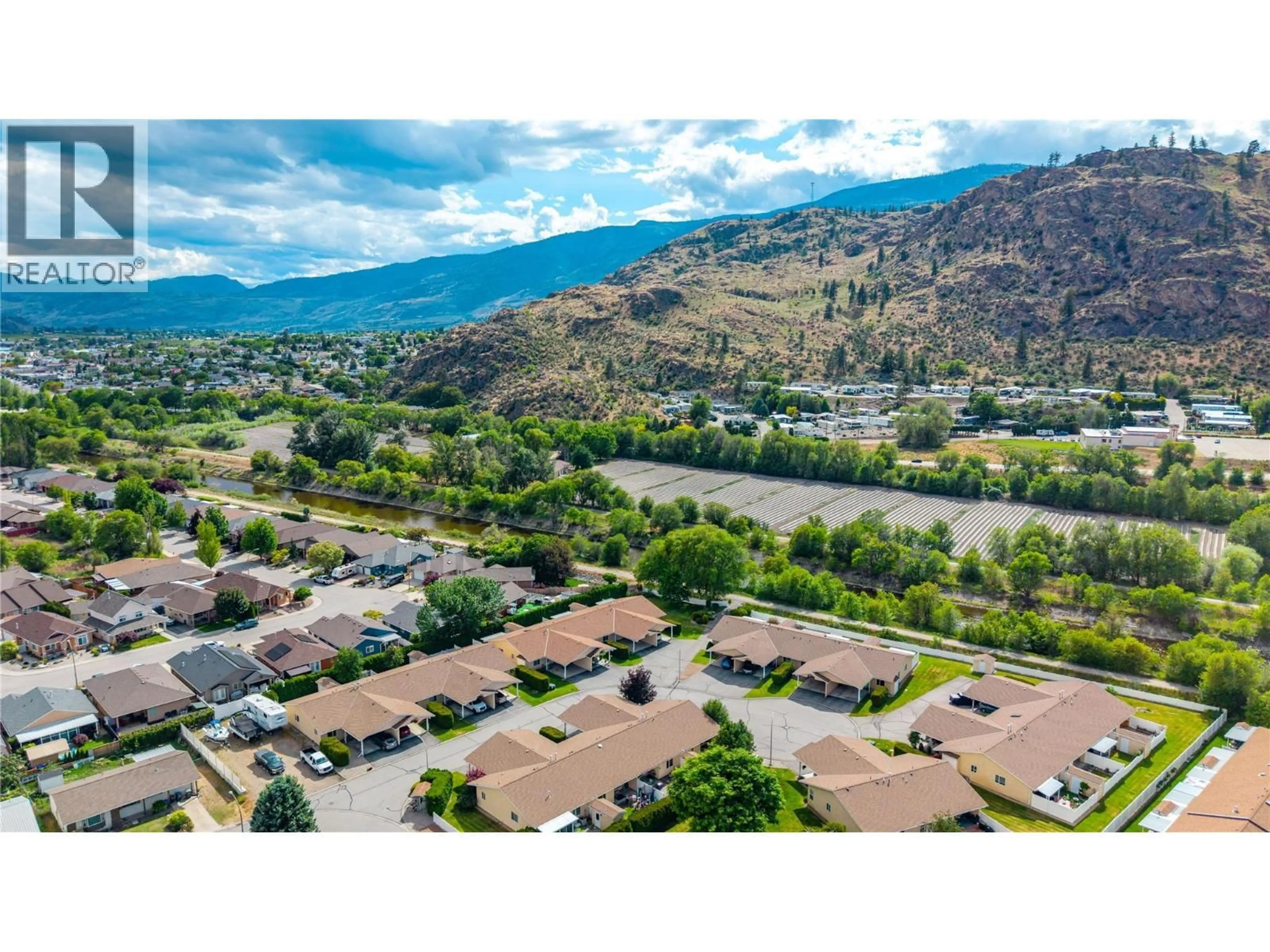 A pic from outside/outdoor area/front of a property/back of a property/a pic from drone, mountain view for 8 - 145 REDWING PLACE, Oliver British Columbia V0H1T4