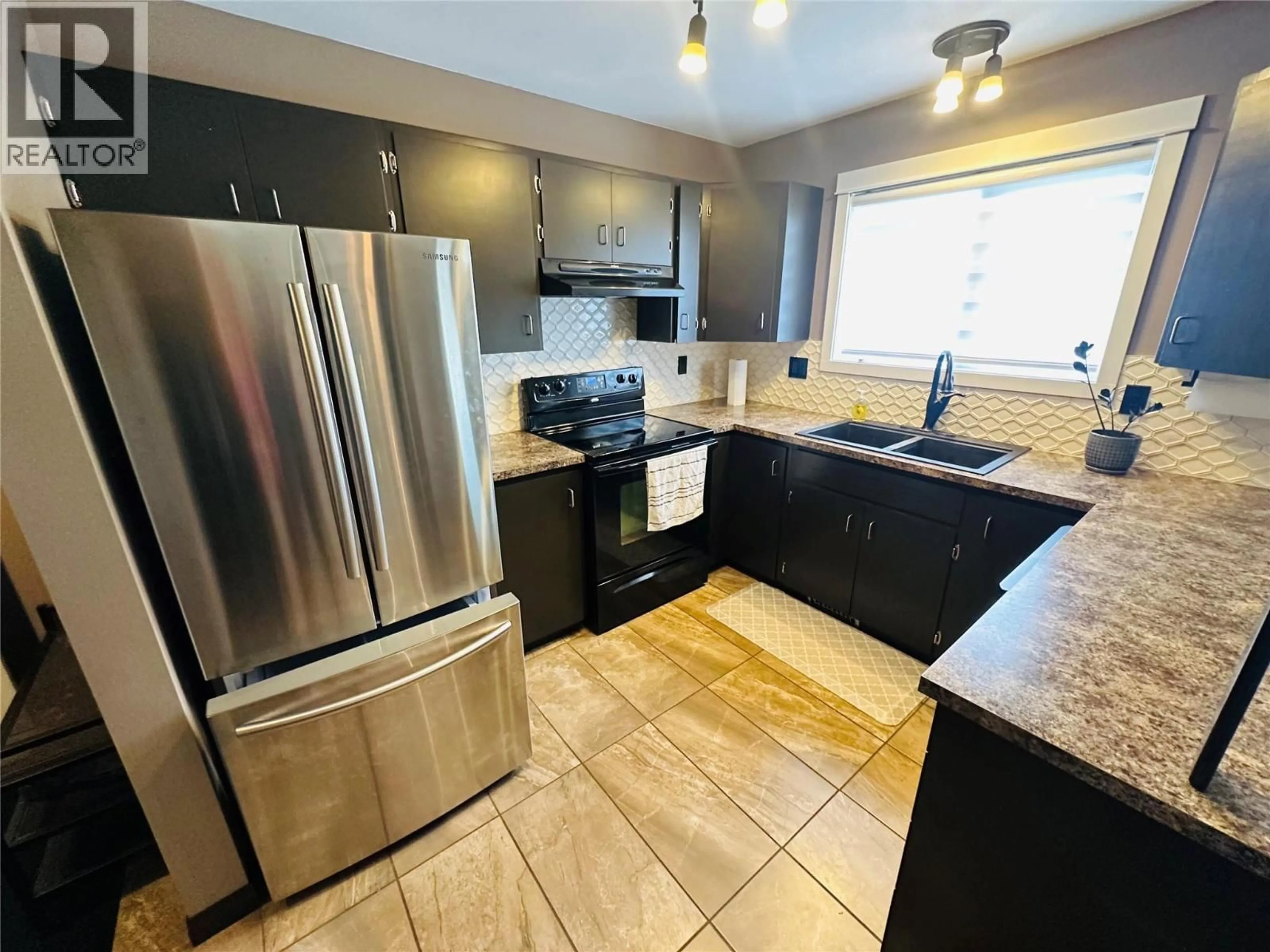 Open concept kitchen, ceramic/tile floor for 4557 VETERANS WAY, Chetwynd British Columbia V0C1J0