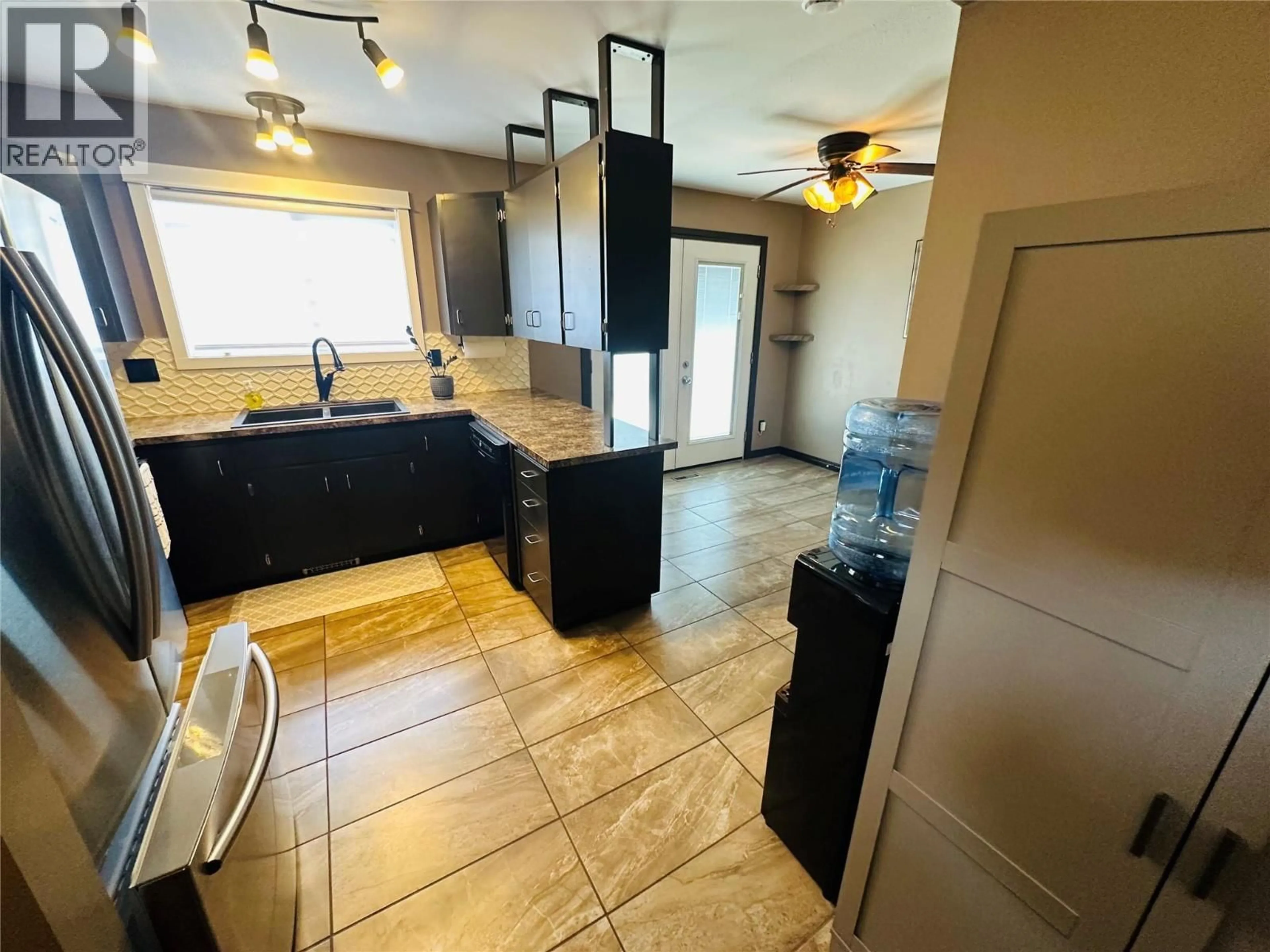 Open concept kitchen, ceramic/tile floor for 4557 VETERANS WAY, Chetwynd British Columbia V0C1J0