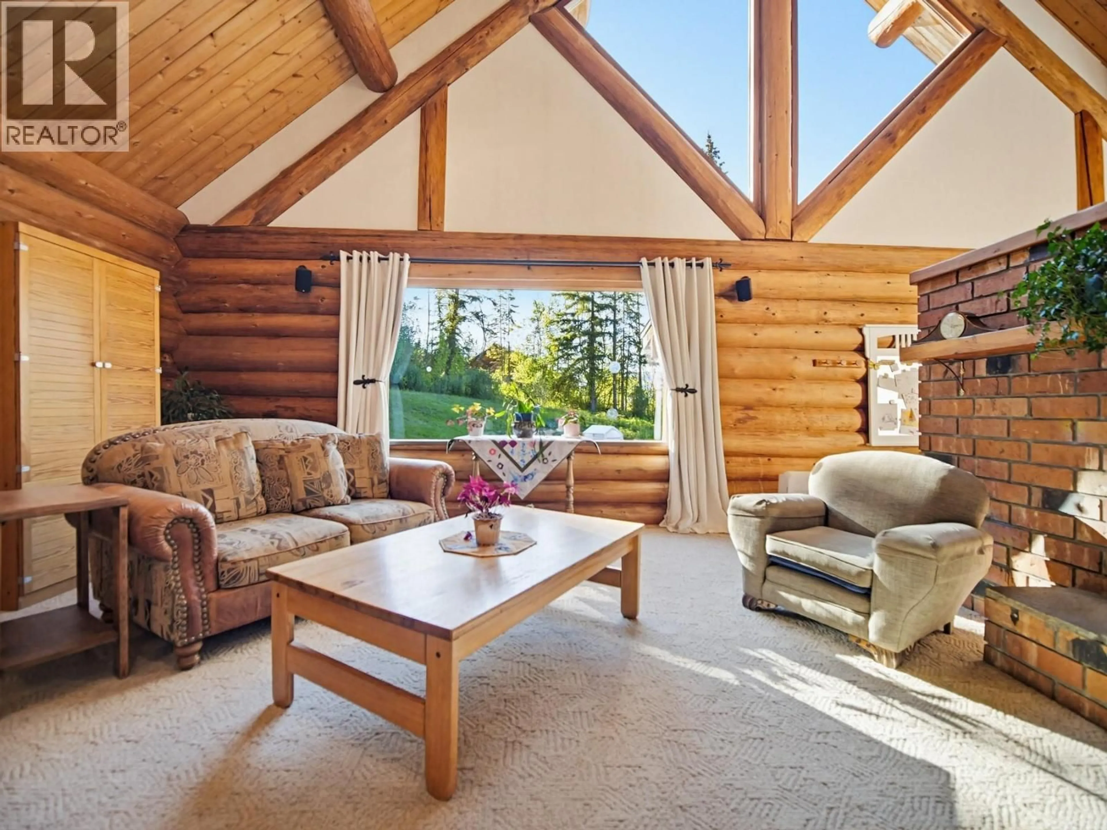 Living room with furniture, wood/laminate floor for 3330 HENDERSON ROAD, Kamloops British Columbia V0E3E1