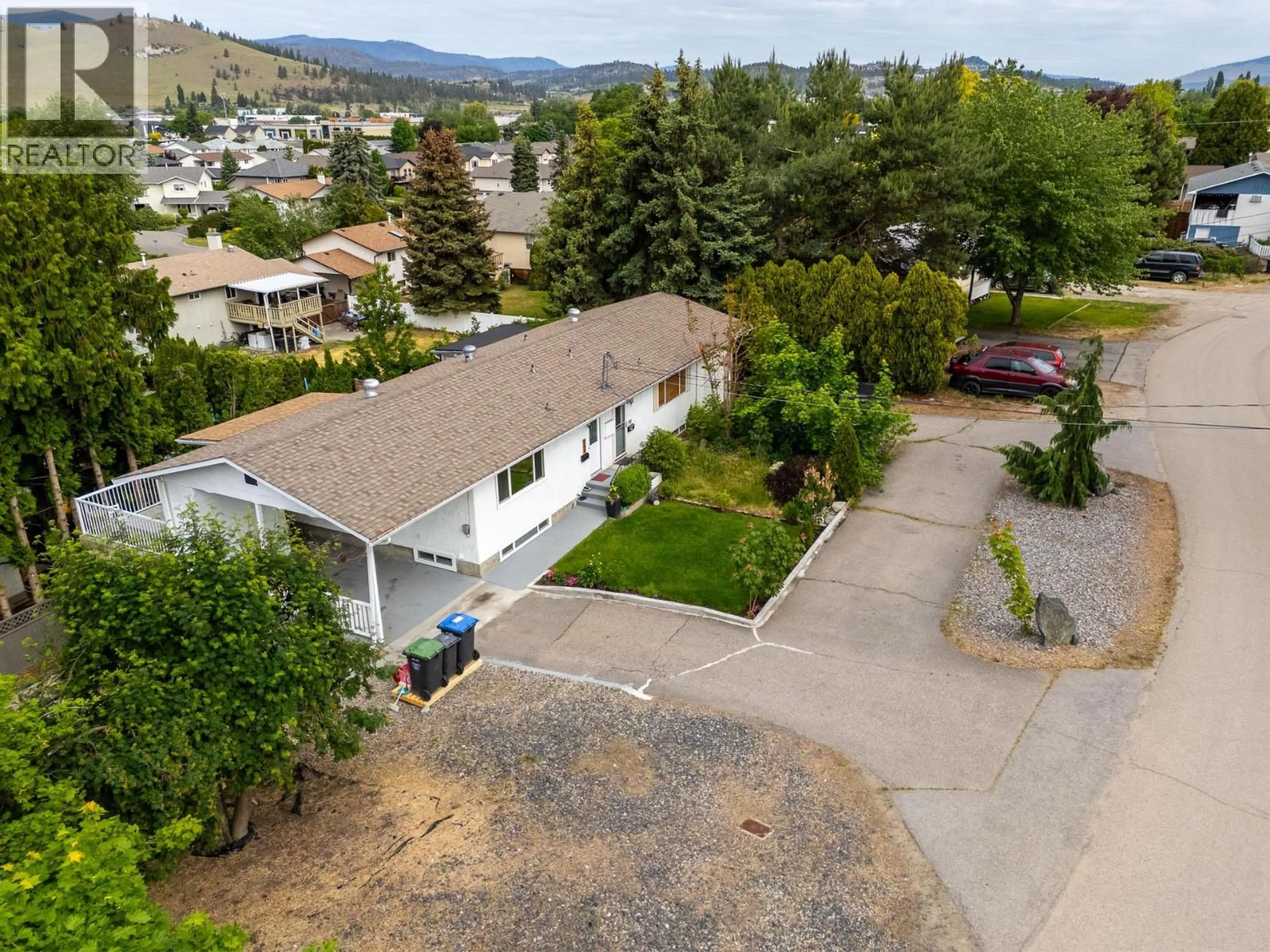 A pic from outside/outdoor area/front of a property/back of a property/a pic from drone, mountain view for 700 FRASER ROAD, Kelowna British Columbia V1X3M3