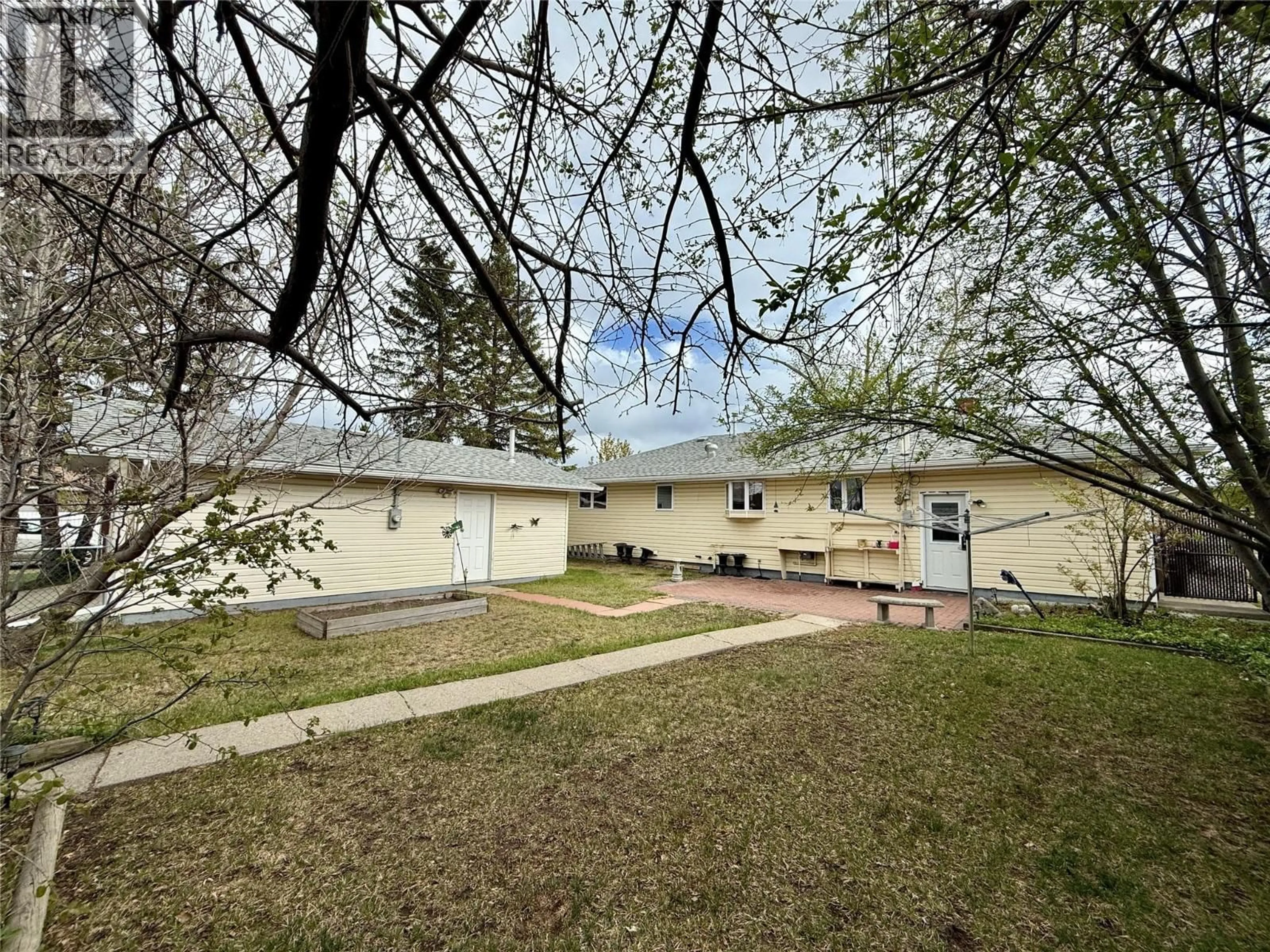 A pic from outside/outdoor area/front of a property/back of a property/a pic from drone, street for 1300 116 AVENUE, Dawson Creek British Columbia V1G3E7
