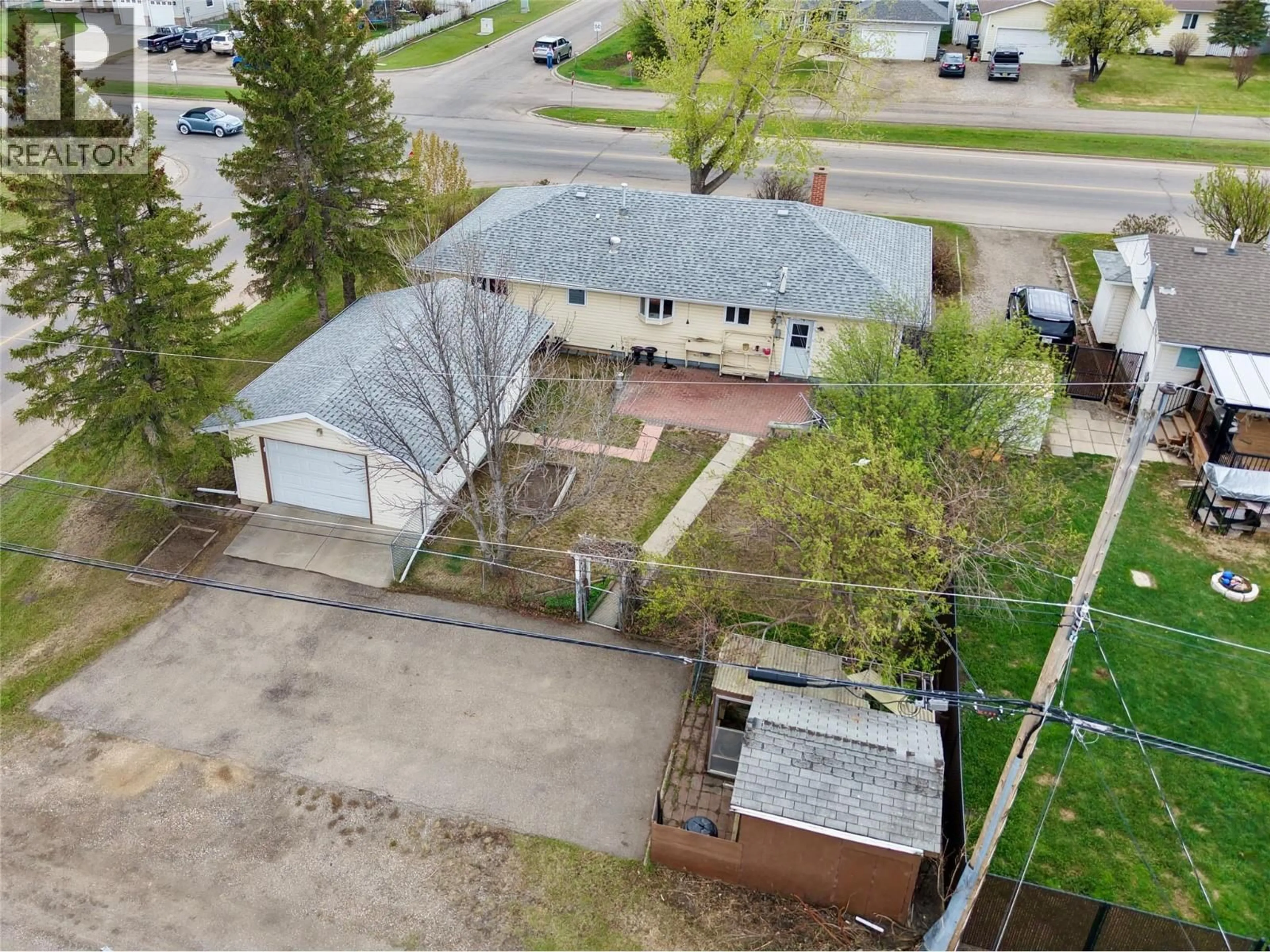 A pic from outside/outdoor area/front of a property/back of a property/a pic from drone, street for 1300 116 AVENUE, Dawson Creek British Columbia V1G3E7