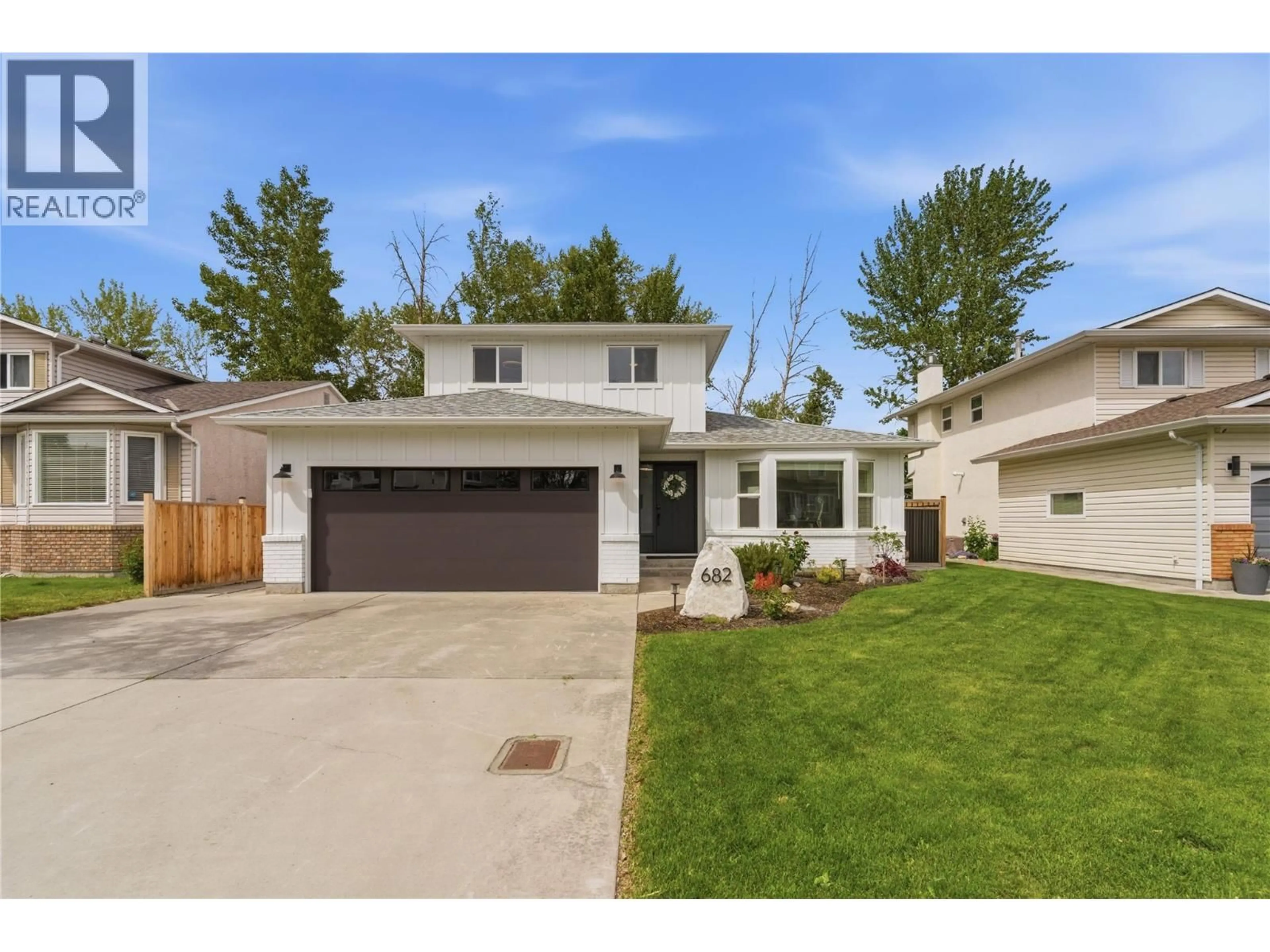 Home with vinyl exterior material, street for 682 COOK ROAD, Kelowna British Columbia V1W3G7