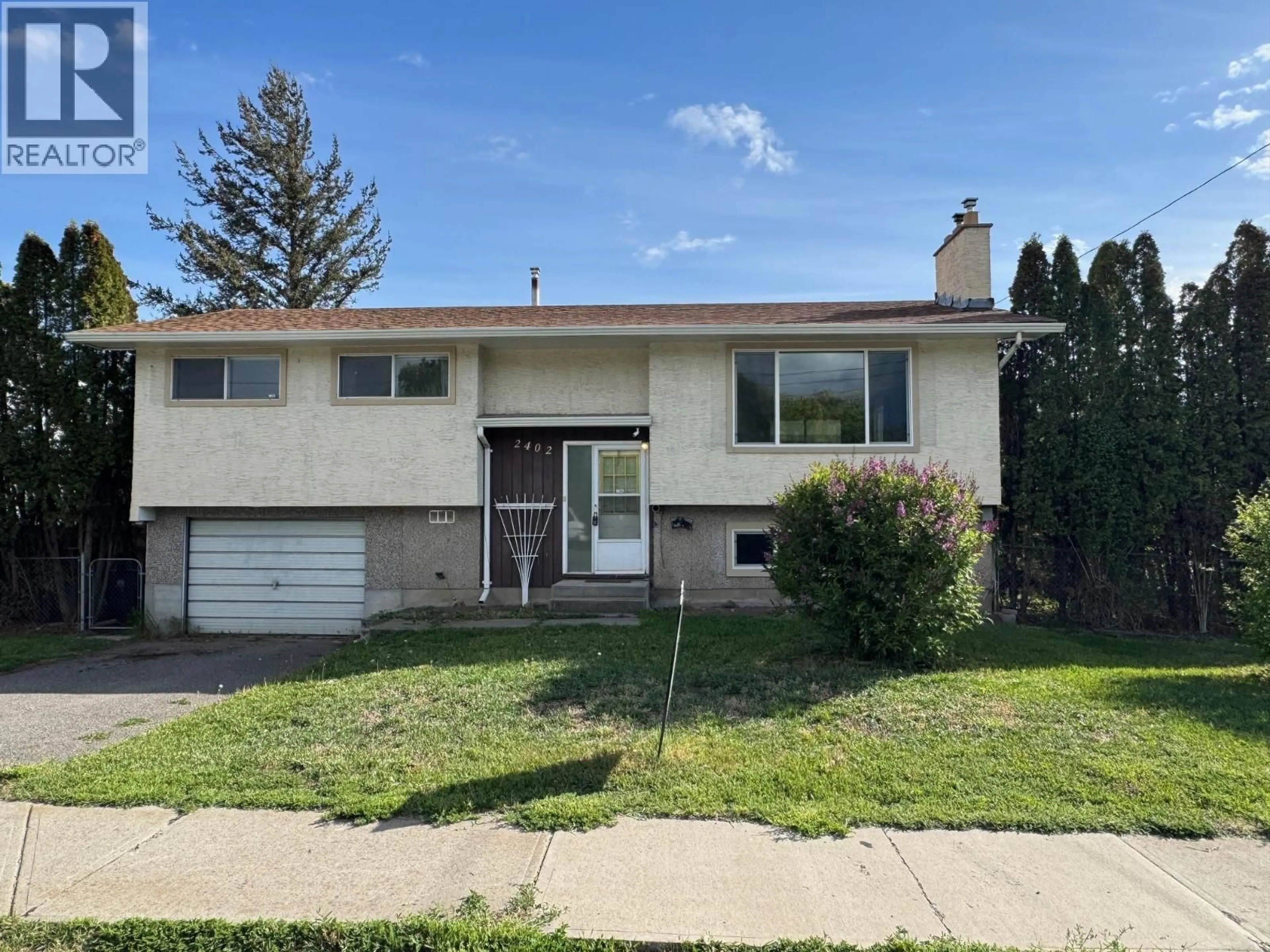 Home with vinyl exterior material, street for 2402 CLAPPERTON AVENUE, Merritt British Columbia V1K1A2
