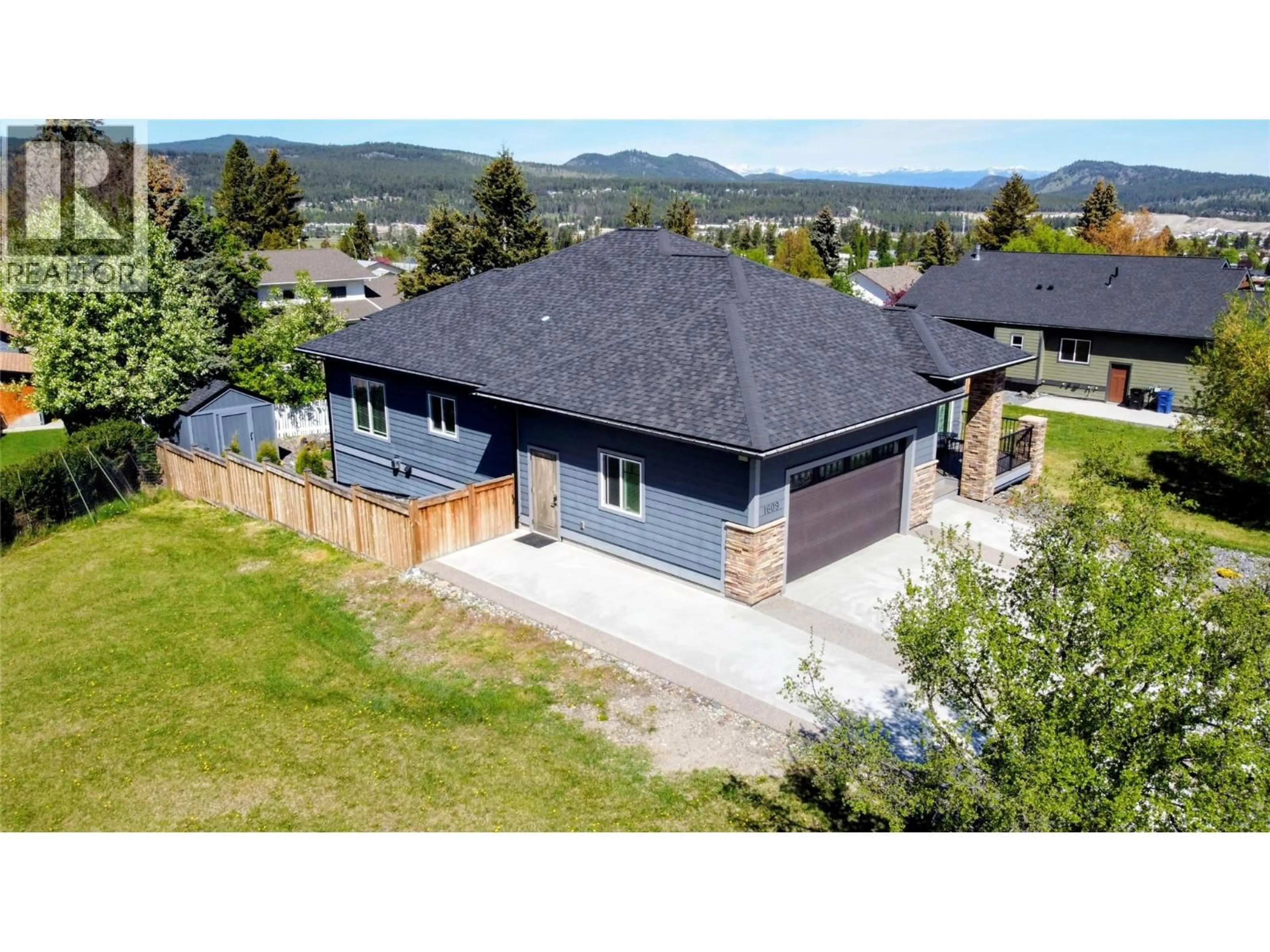 A pic from outside/outdoor area/front of a property/back of a property/a pic from drone, mountain view for 1609 8 AVENUE SOUTH, Cranbrook British Columbia V1C5N9