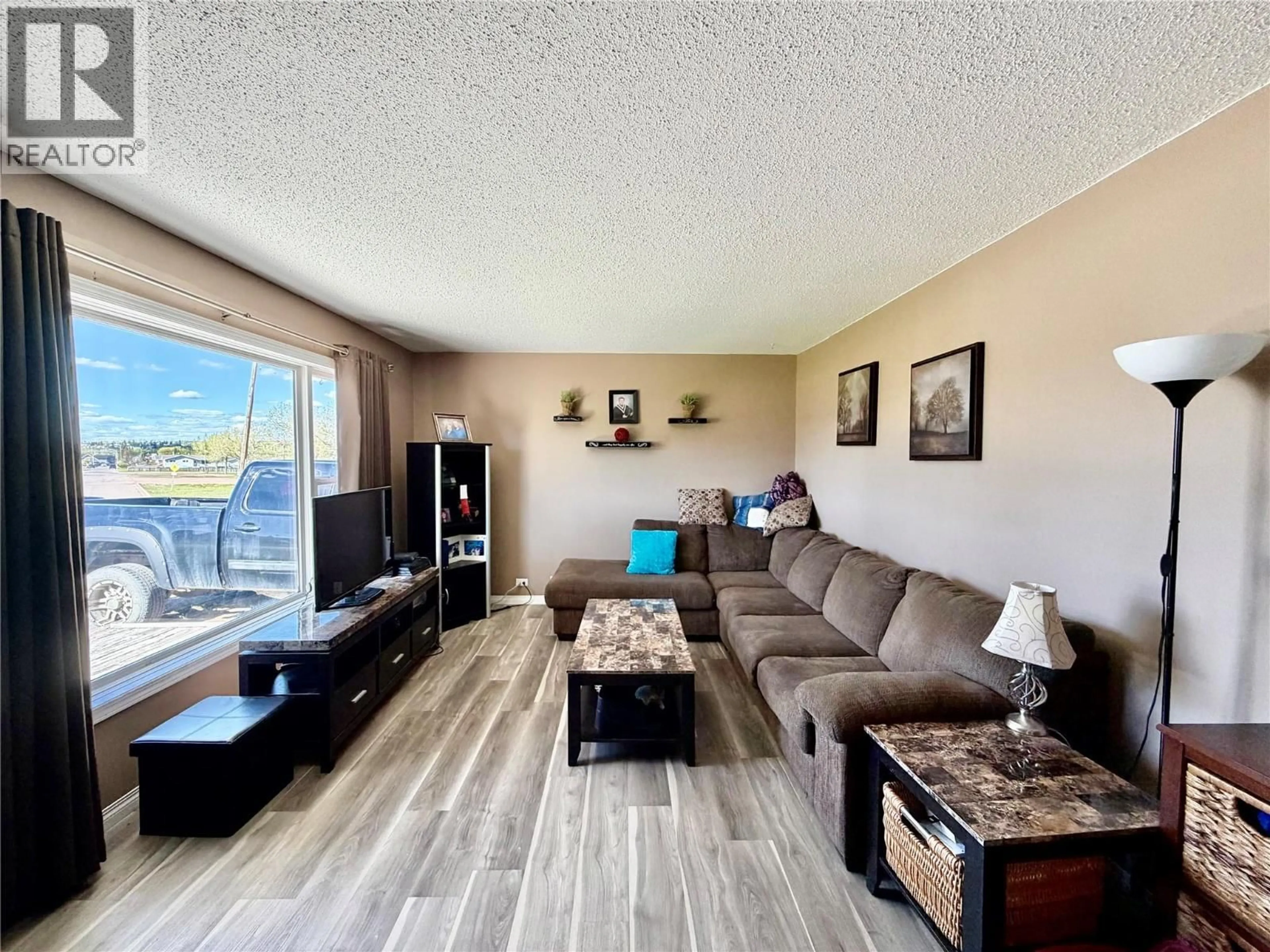 Living room with furniture, wood/laminate floor for 10905 TURGEON DRIVE, Dawson Creek British Columbia V1G2W9
