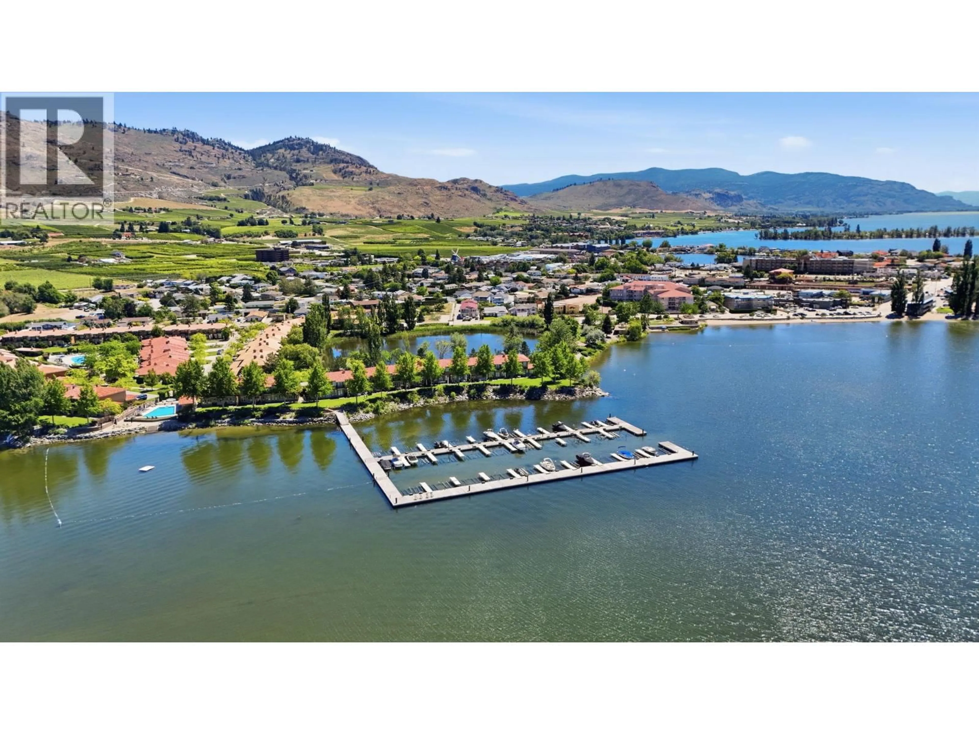 A pic from outside/outdoor area/front of a property/back of a property/a pic from drone, water/lake/river/ocean view for 56 - 7200 COTTONWOOD DRIVE, Osoyoos British Columbia V0H1V3