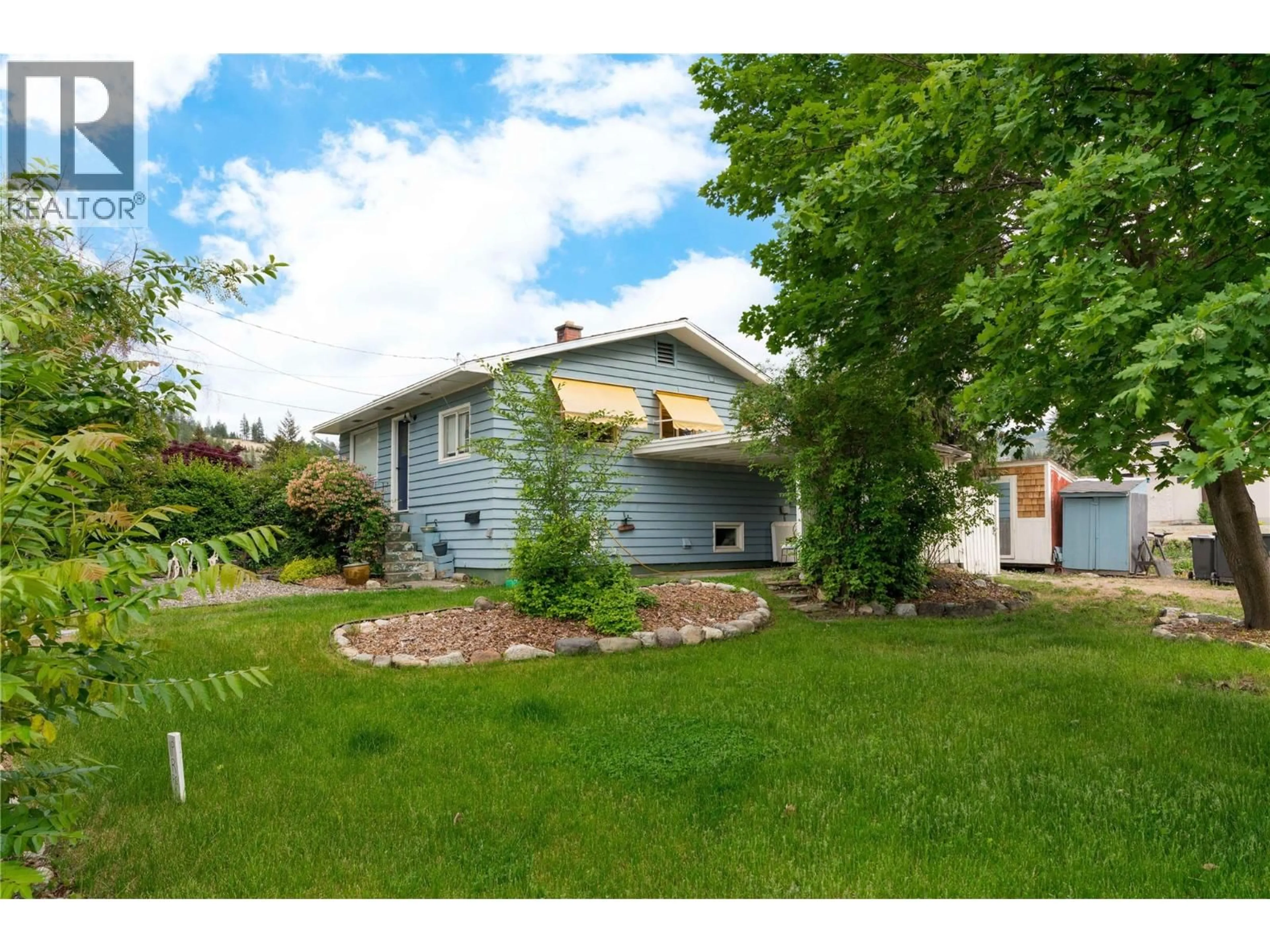 A pic from outside/outdoor area/front of a property/back of a property/a pic from drone, street for 779 MCCLURE ROAD, Kelowna British Columbia V1W1M4
