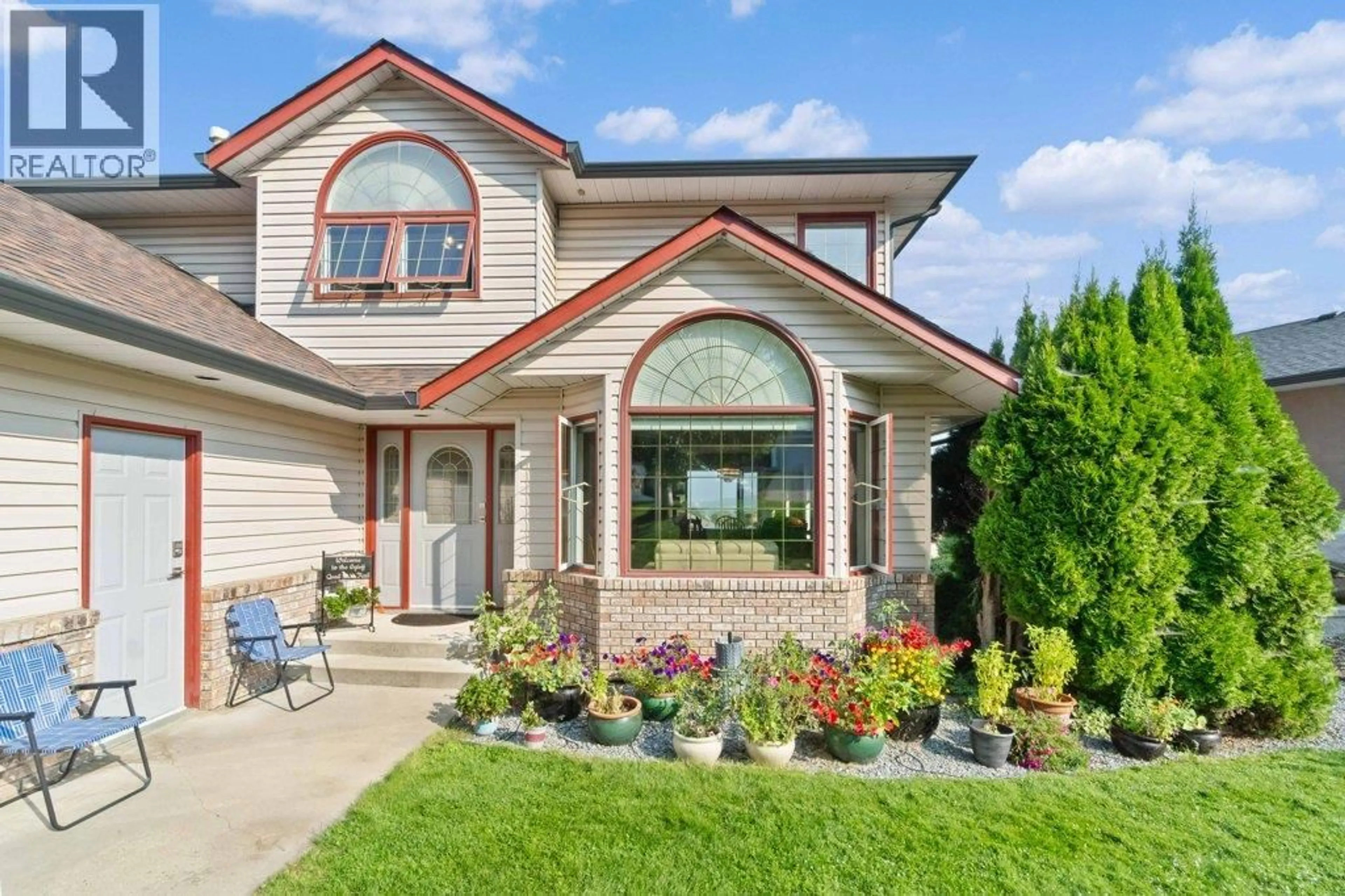 Home with brick exterior material, street for 2121 3 AVENUE SOUTHEAST, Salmon Arm British Columbia V1E1K1
