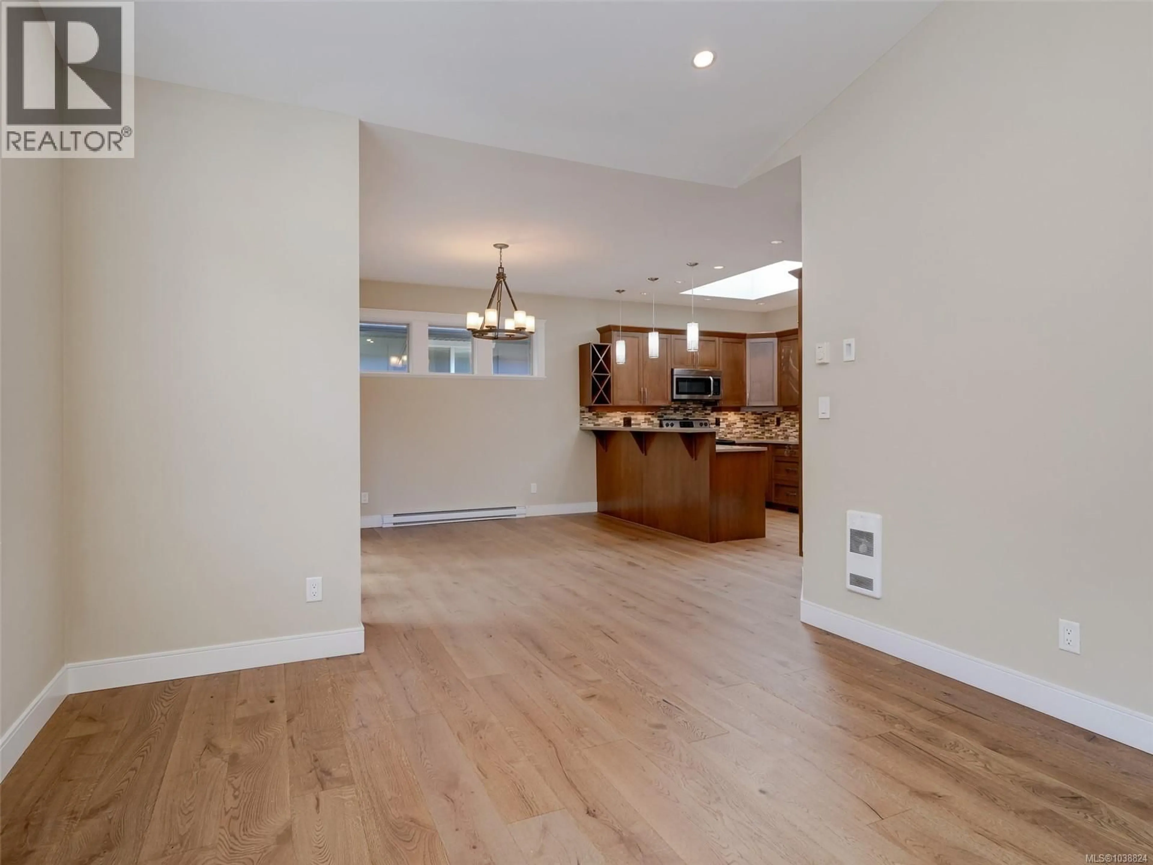 Open concept kitchen, wood/laminate floor for 3628 VITALITY ROAD, Langford British Columbia V9C0E9