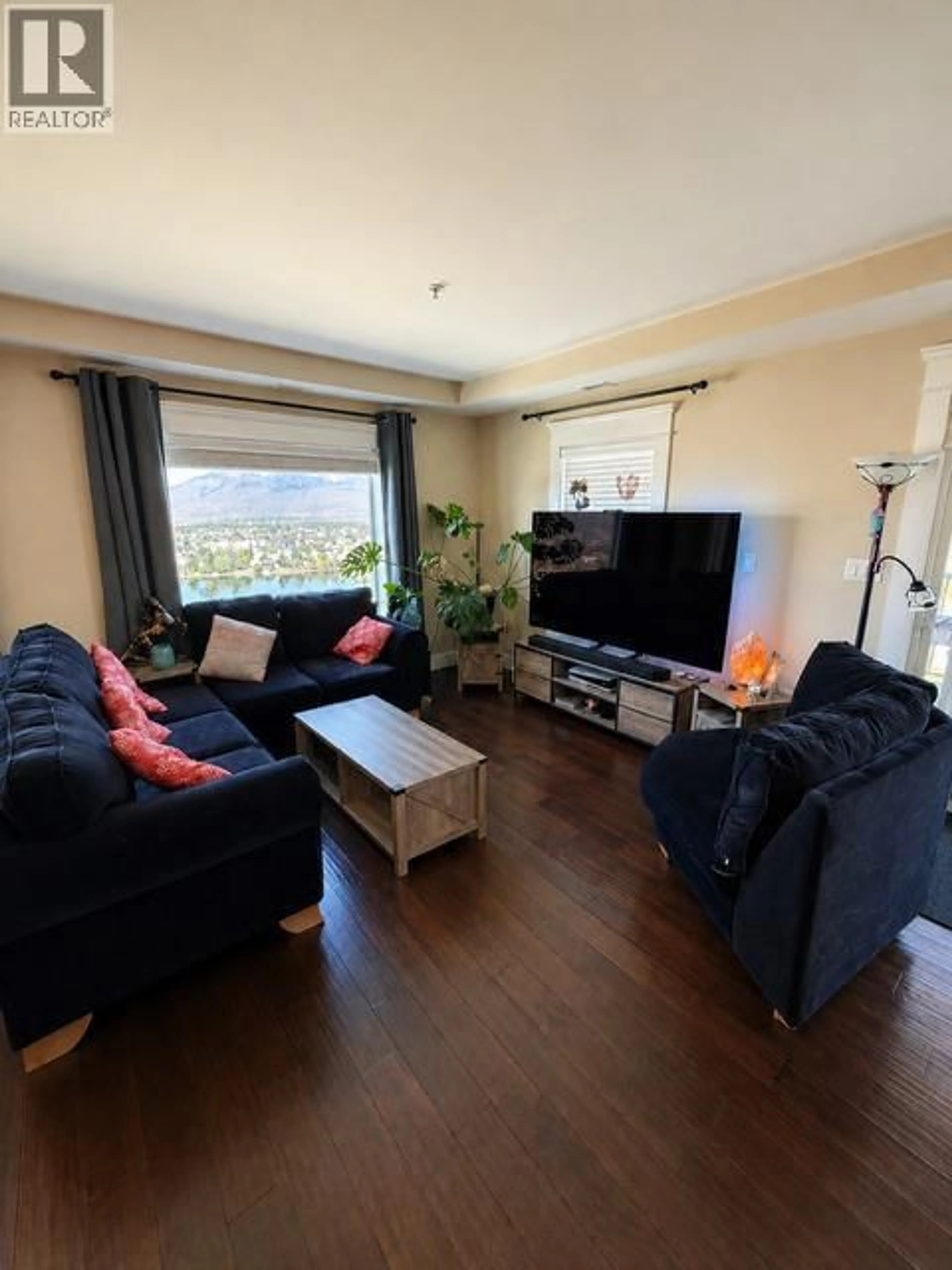 Living room with furniture, wood/laminate floor for 503 - 975 VICTORIA STREET WEST, Kamloops British Columbia V2C0C2
