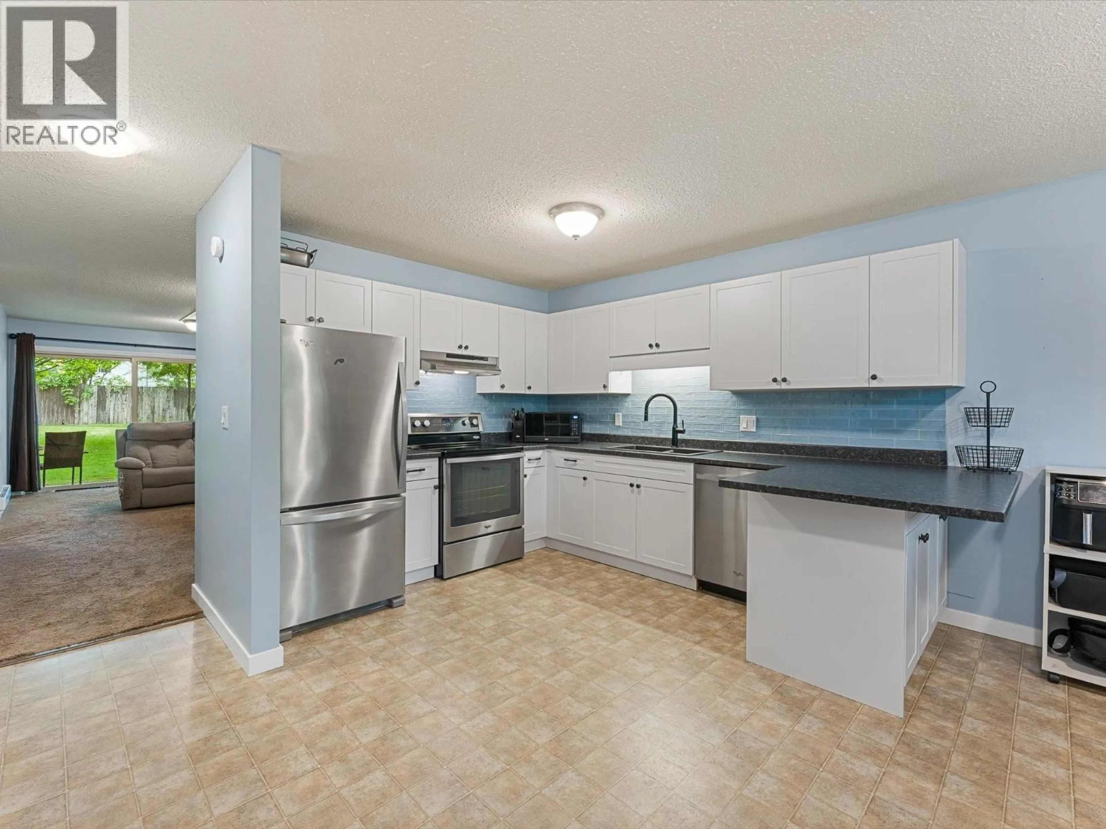 Open concept kitchen, ceramic/tile floor for 107 - 215 MILLS ROAD, Kelowna British Columbia V1X4G6