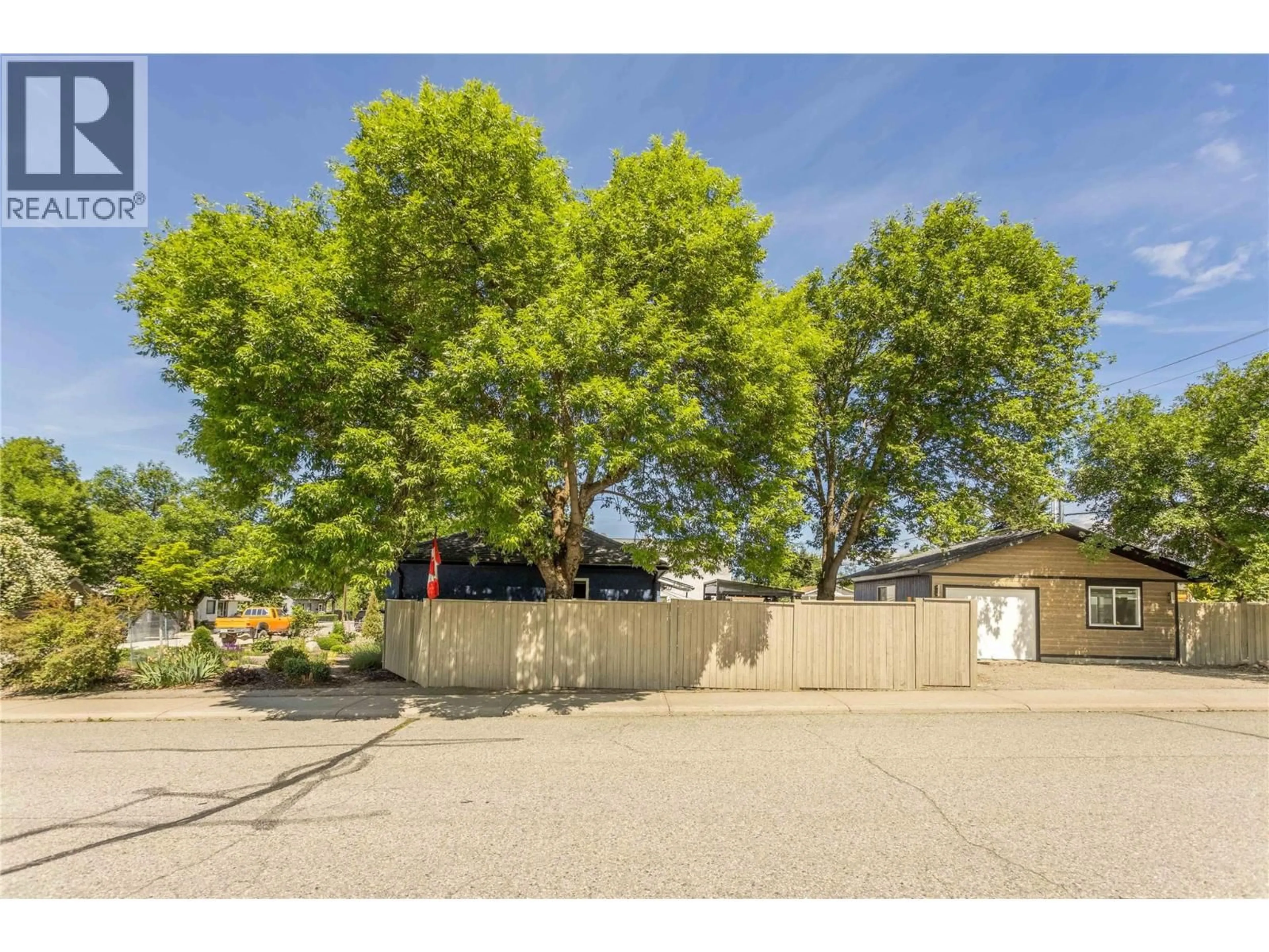 A pic from outside/outdoor area/front of a property/back of a property/a pic from drone, street for 1298 KILWINNING STREET, Penticton British Columbia V2A4P3