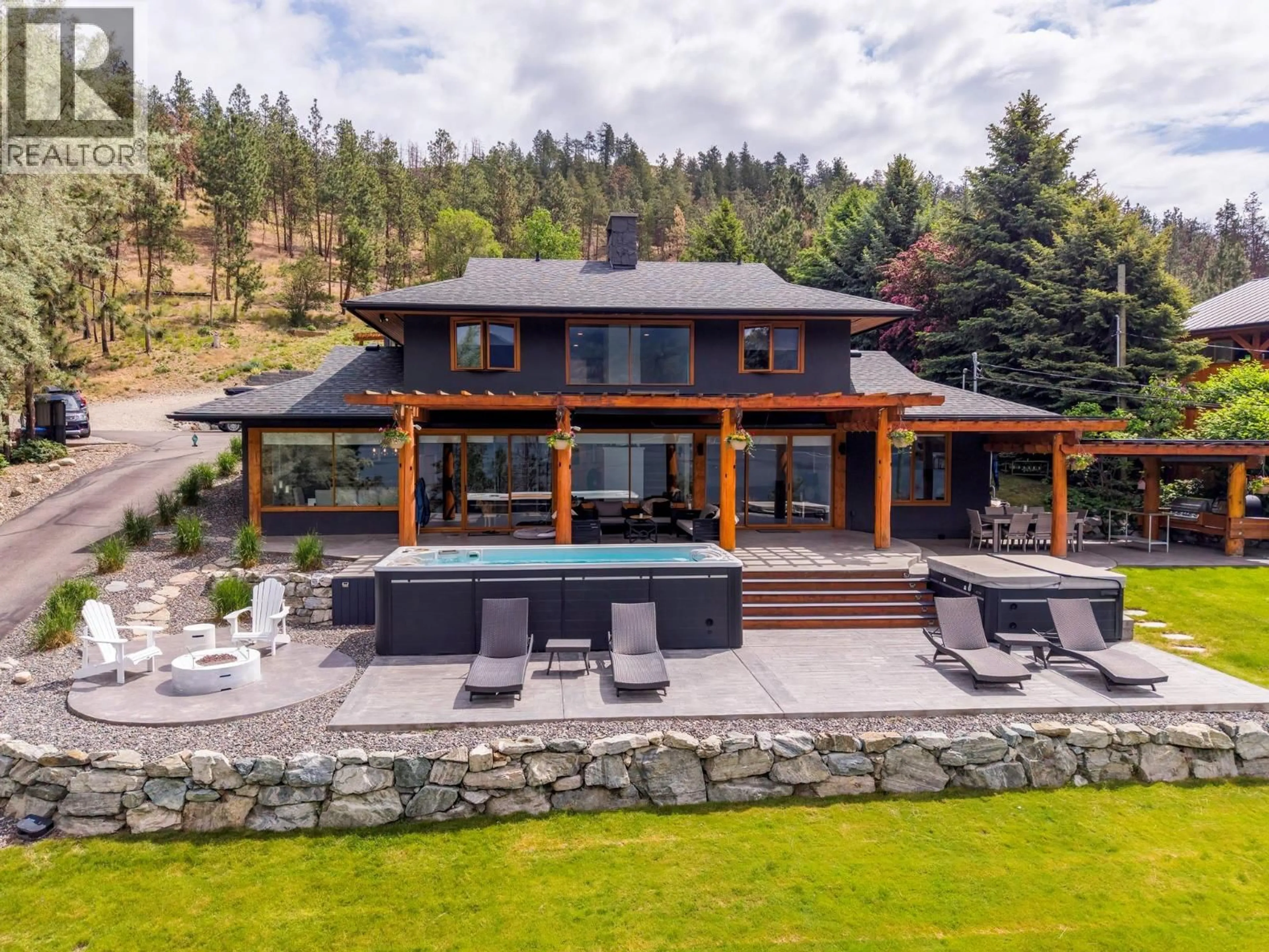 A pic from outside/outdoor area/front of a property/back of a property/a pic from drone, water/lake/river/ocean view for 9887 OKANAGAN CENTRE ROAD WEST, Lake Country British Columbia V4V2J3