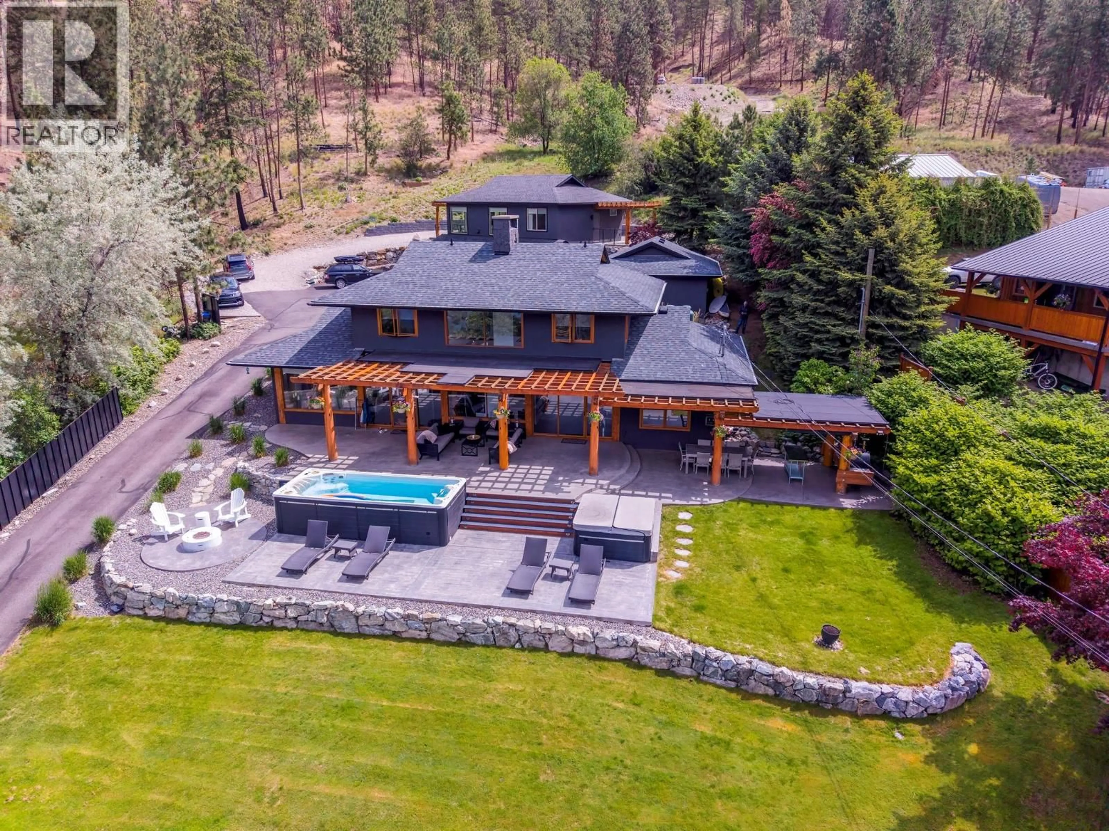 A pic from outside/outdoor area/front of a property/back of a property/a pic from drone, unknown for 9887 OKANAGAN CENTRE ROAD WEST, Lake Country British Columbia V4V2J3